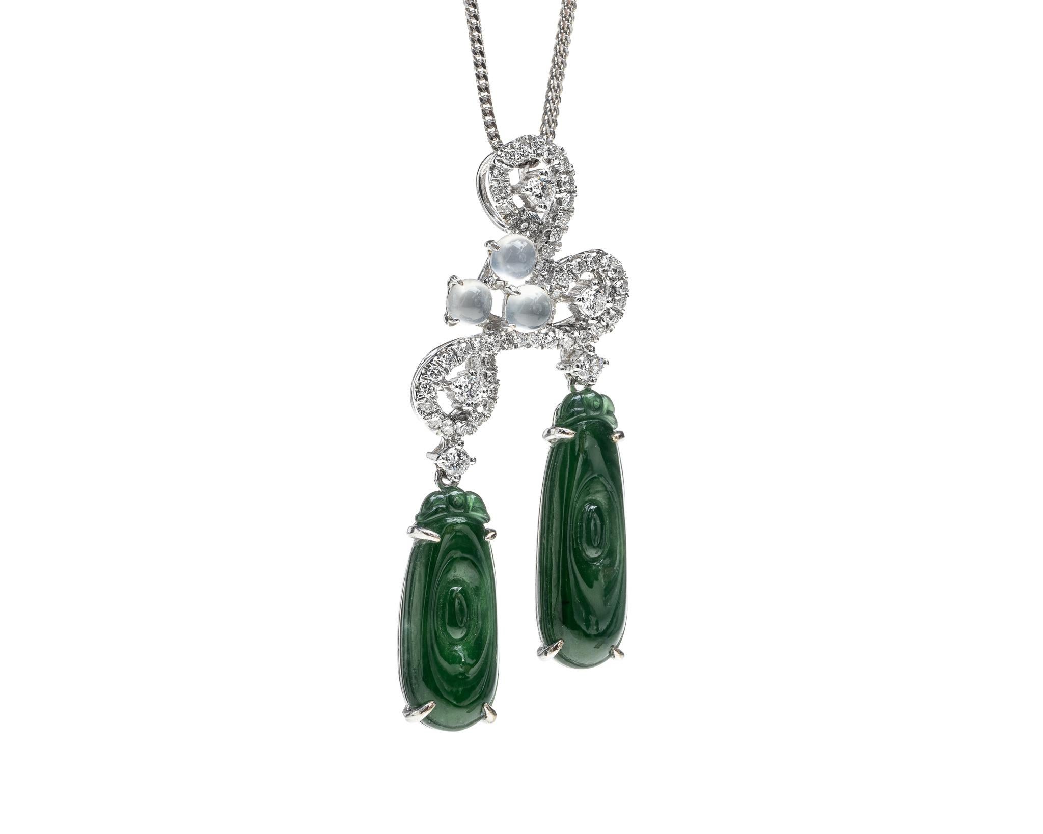 This is an all natural, untreated jadeite jade carved ancient gold coin pendant set with icy jadeite jade stones on a 18K white gold and diamond bail.  The carved ancient gold coin symbolizes money, wealth and prosperity.
   
It measures 1.66 inches