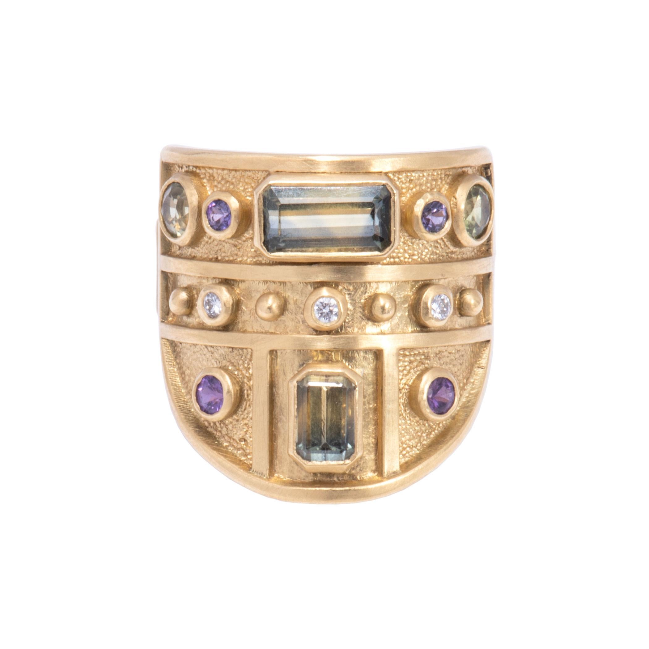 Diana the Huntress, ancient goddess of the moon guided the stars in her chariot. The arc of her journey is reflected in glittering green and purple sapphires 2.57tcw in radiant cut and round stones. Twinkle of round cut diamonds .06 tcw scores the