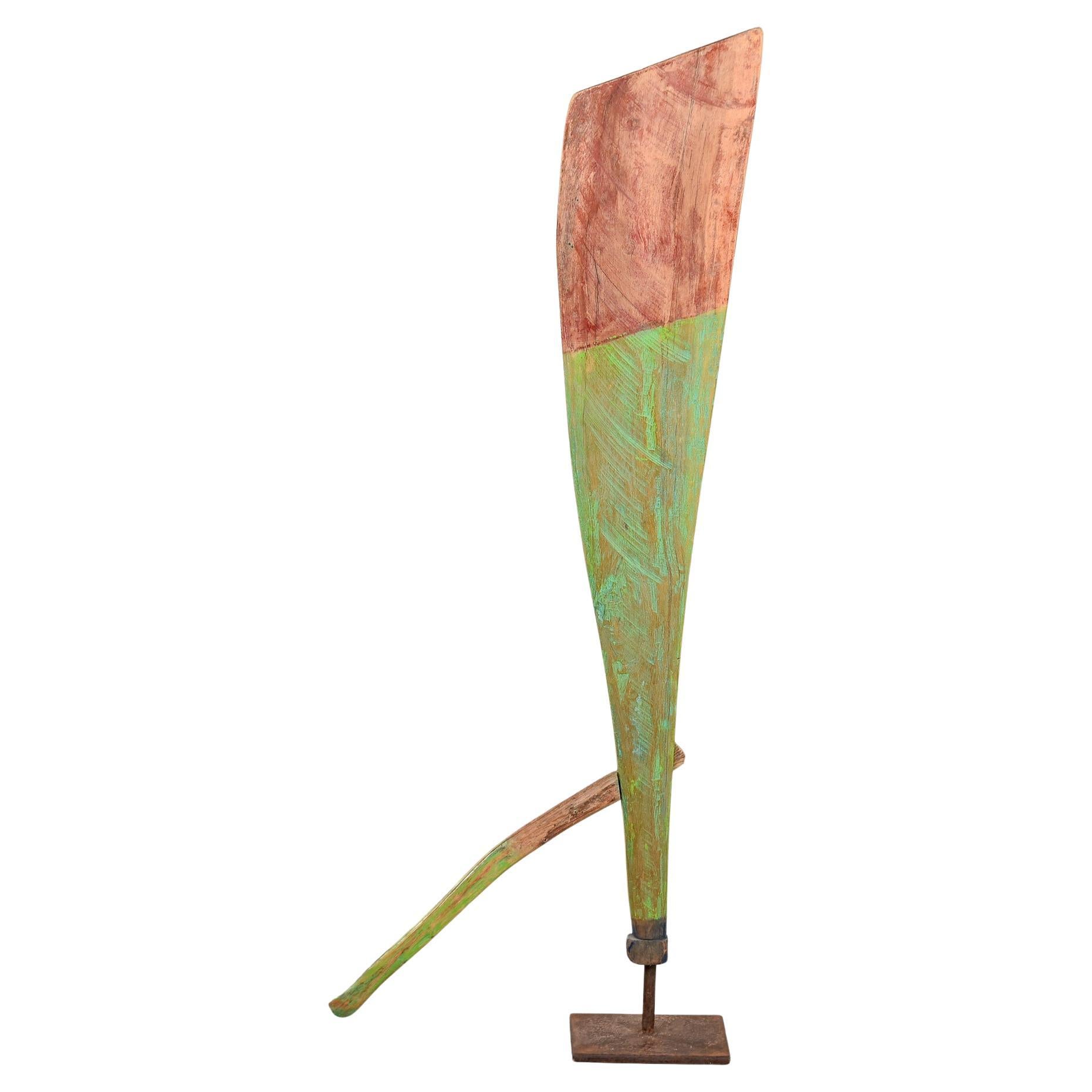 Green and Red Painted Antique Wood Boat Rudder on Iron Stand
