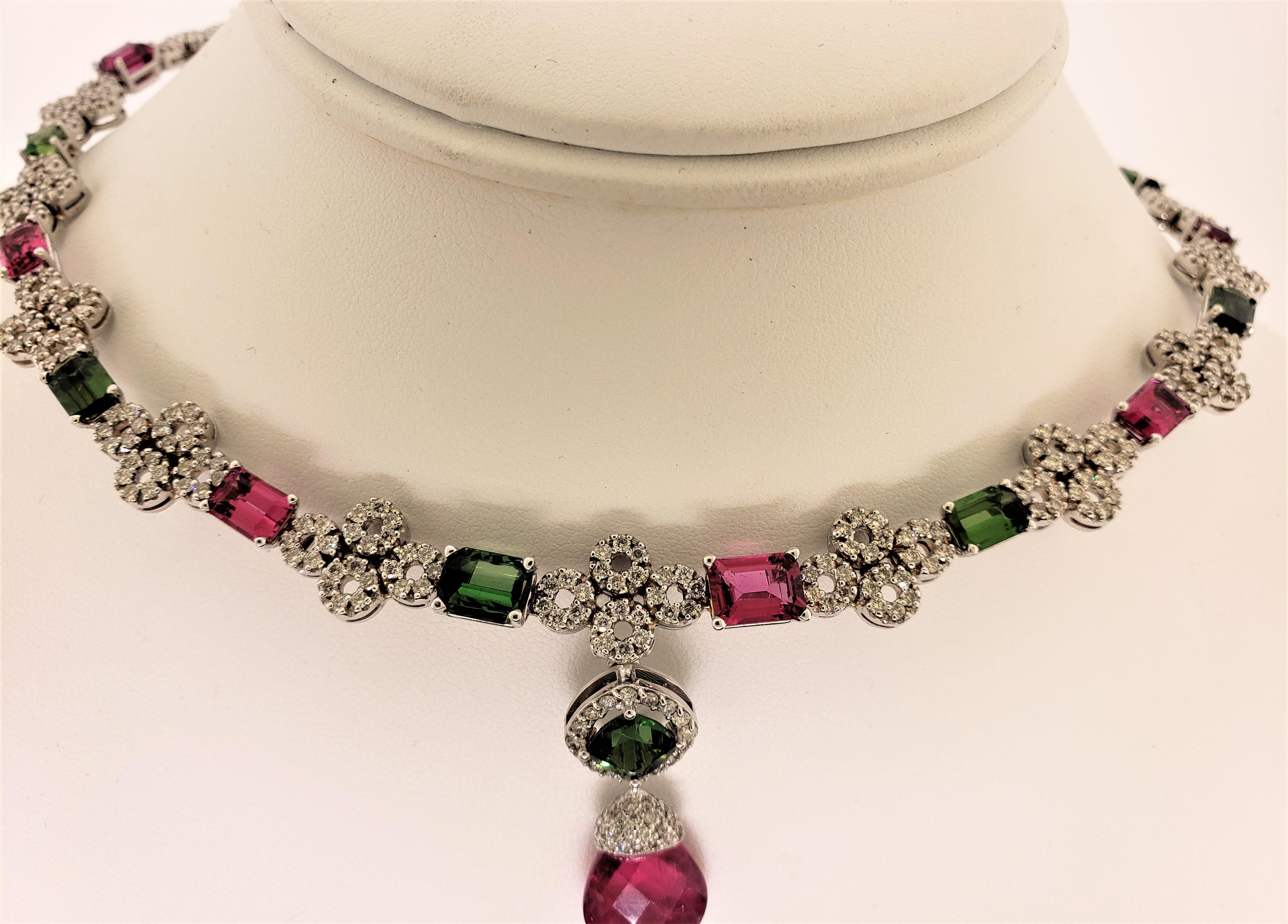 Designed, created, and manufactured in our workshops, this necklace is designed to feature alternating colors of red and green tourmaline.  The mounting is produced in 18 Karat White Gold weighing 60 grams and is constructed of small gold and