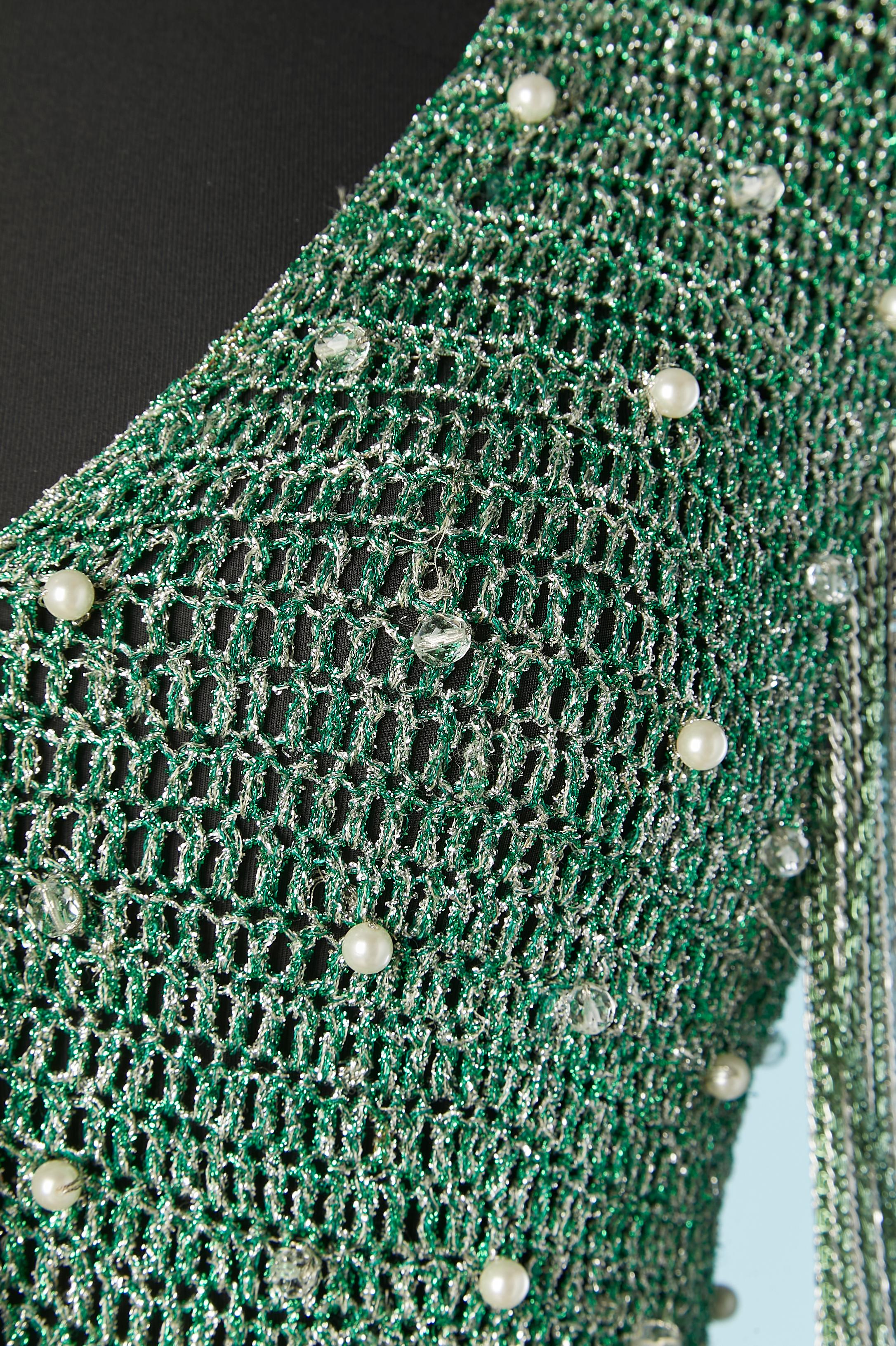 Green and silver cardigan woven with silver chain, beads and pearls with fringes edge in the bottom . Snap closure in the middle front and long fringes of green and silver chains in the middle front ( fixed on the snap) 
SIZE S