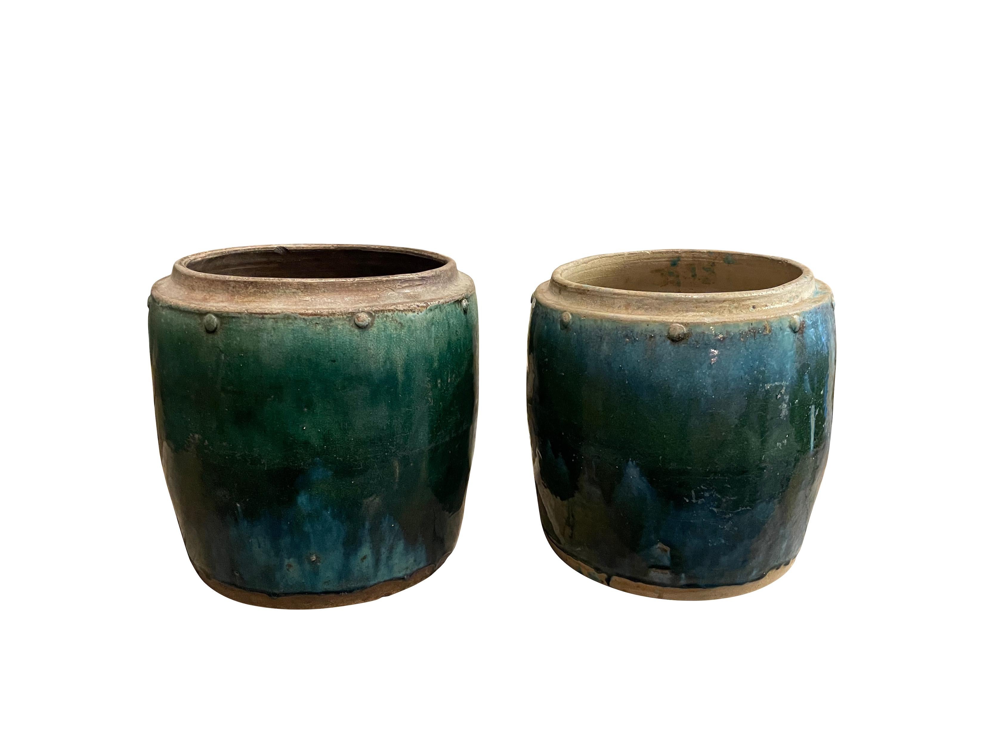 18th century Borneo terracotta pot used to store ginger root.
Beautiful green/turquoise glaze.
Decorative grommets along top.
