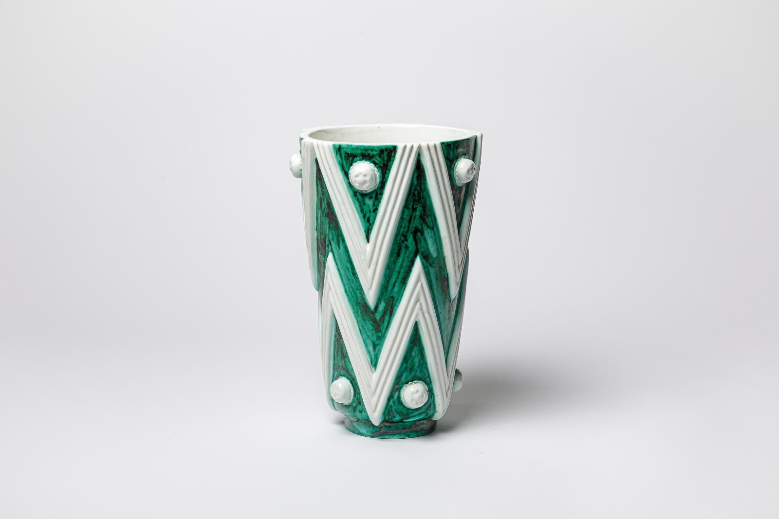 Green and white glazed ceramic vase by Sainte Radegonde. 
Artist monogram under the base. Circa 1960-1970.
H : 11.02’ x 6.7’ inches.