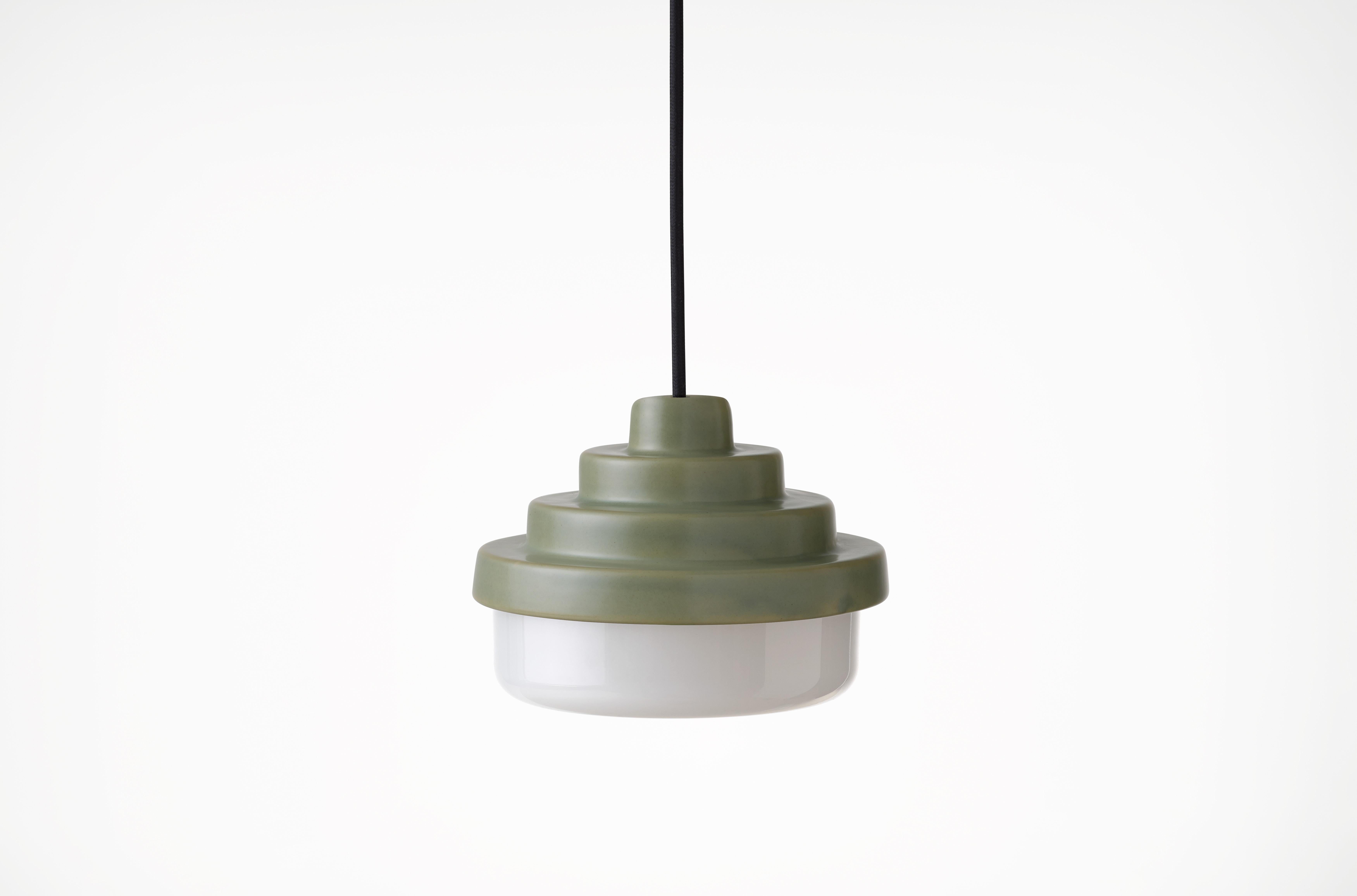 Green and White Honey Pendant Light by Coco Flip
Dimensions: D 18 x W 18 x H 13 cm
Materials: Slip cast ceramic stoneware with blown glass. 
Weight: Approx. 2kg
Glass finishes: White.
Ceramic finishes: Green satin glaze. 

Standard fixtures