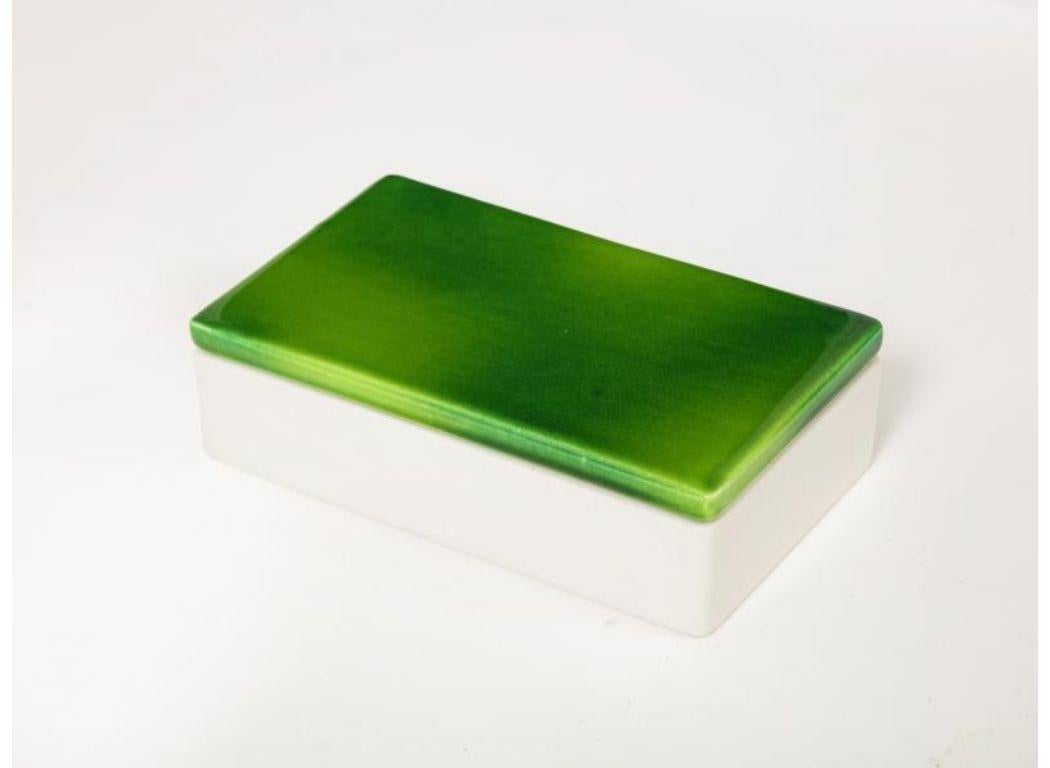 Green and White Two-Tone Glazed Porcelain Lidded Box by Raymor, Italy, c. 1960

Simple glazed ceramic box from Raymor. The lid of the box features a beautiful glaze that fluctuates between a very saturated grass-green and a less saturated,