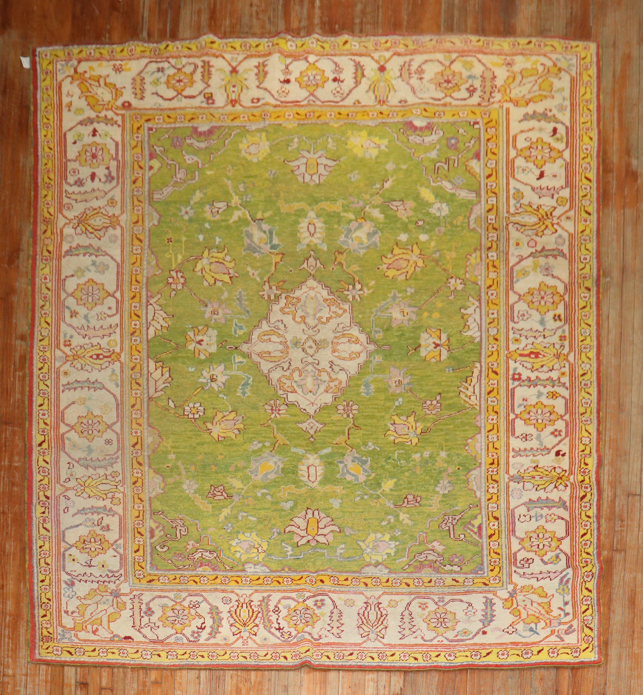 An early 20th century Antique Turkish Oushak rug highlighted by an apple green color ground.

Measures: 8'8'' x 10'7''.