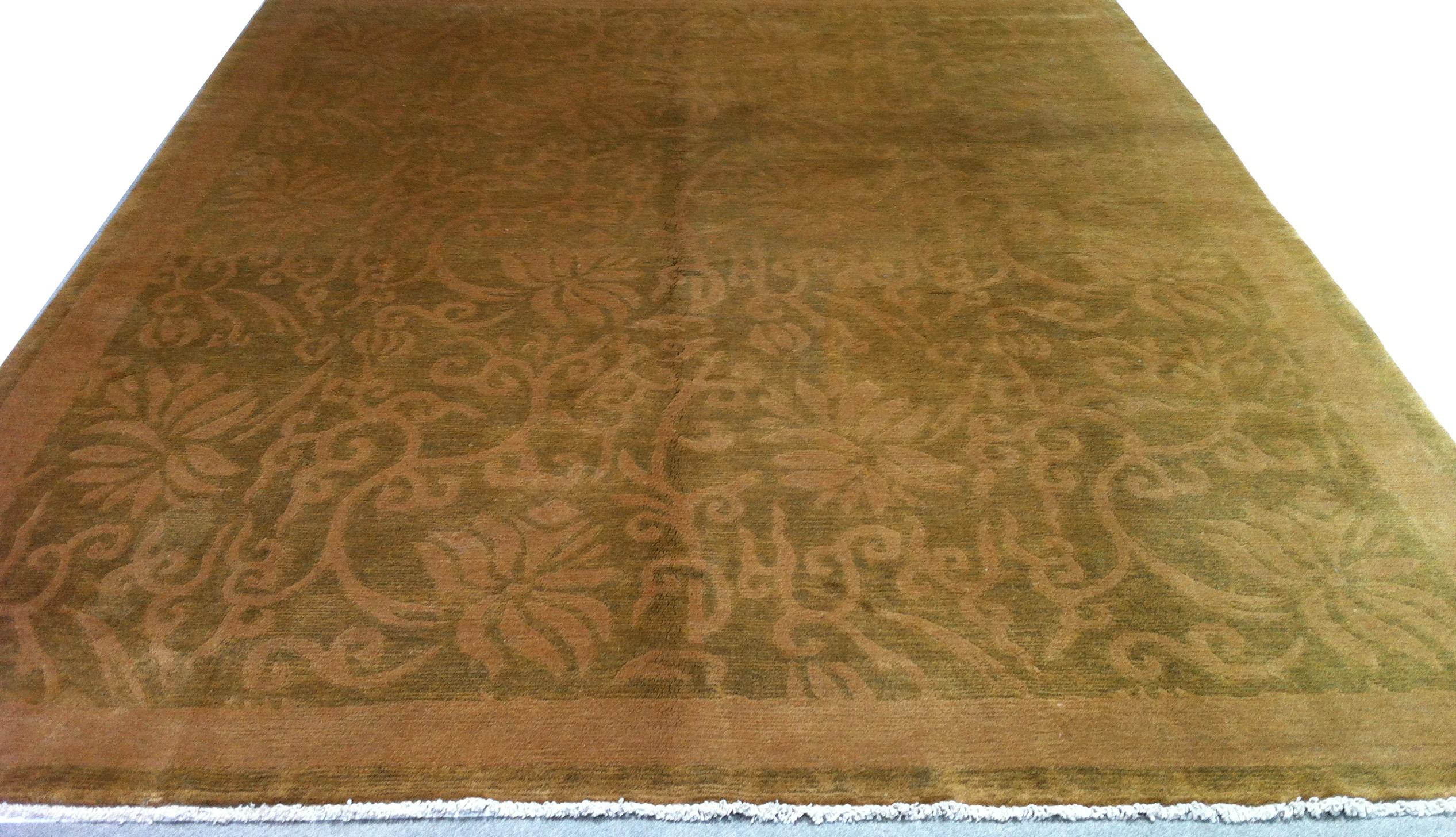 An antique wash creates a wonderfully warm patina in this hand knotted wool rug from Nepal. The subtle floral pattern in the large center panel brings just the right amount of traditional to a rug that will look equally at home in more contemporary