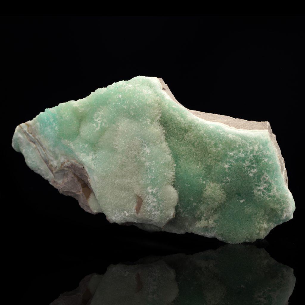 This large teal green specimen is a special find perfect for the discerning mineral enthusiast. Green is a very sought-after color of aragonite along with the crystallized blue and it’s unusual to find pieces of this calcium carbonate mineral with