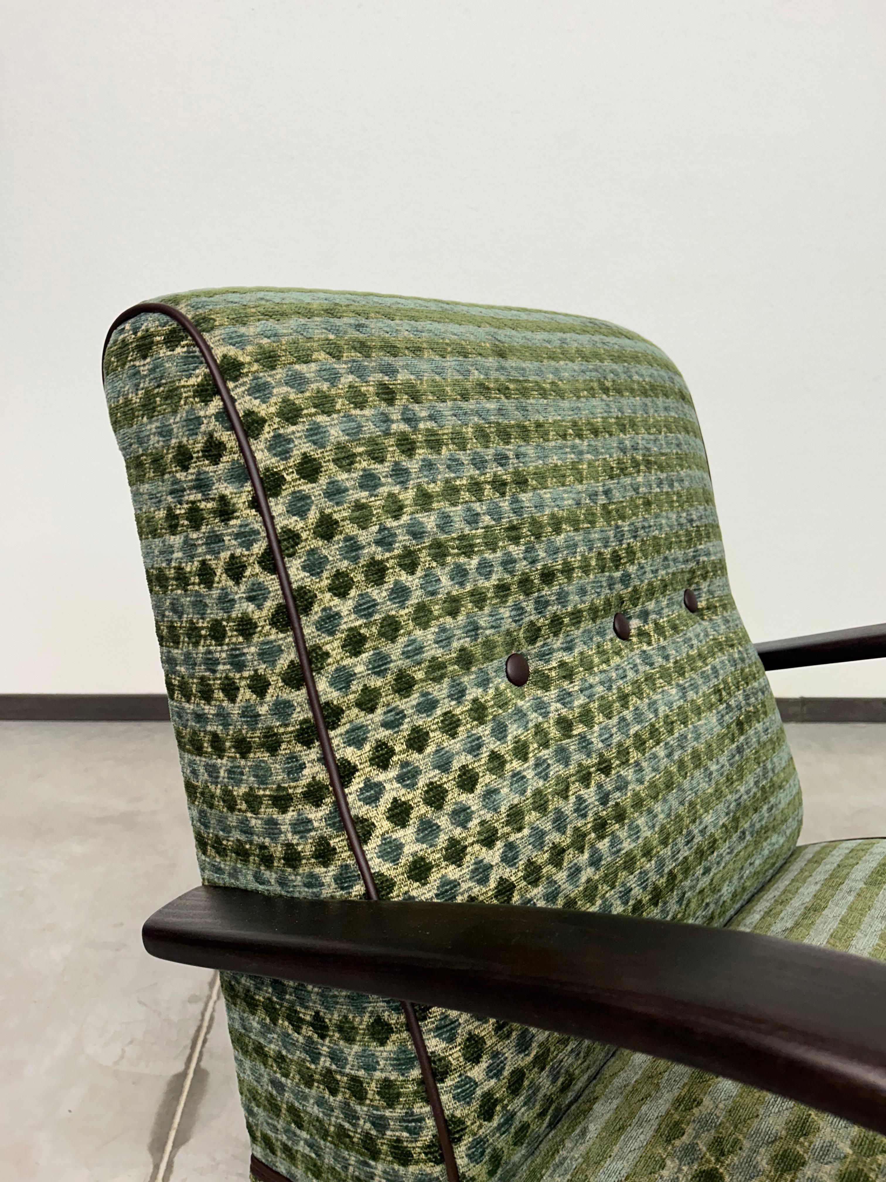 Green art deco armchair by Jindřich Halabala. Professionally stained and repolished.