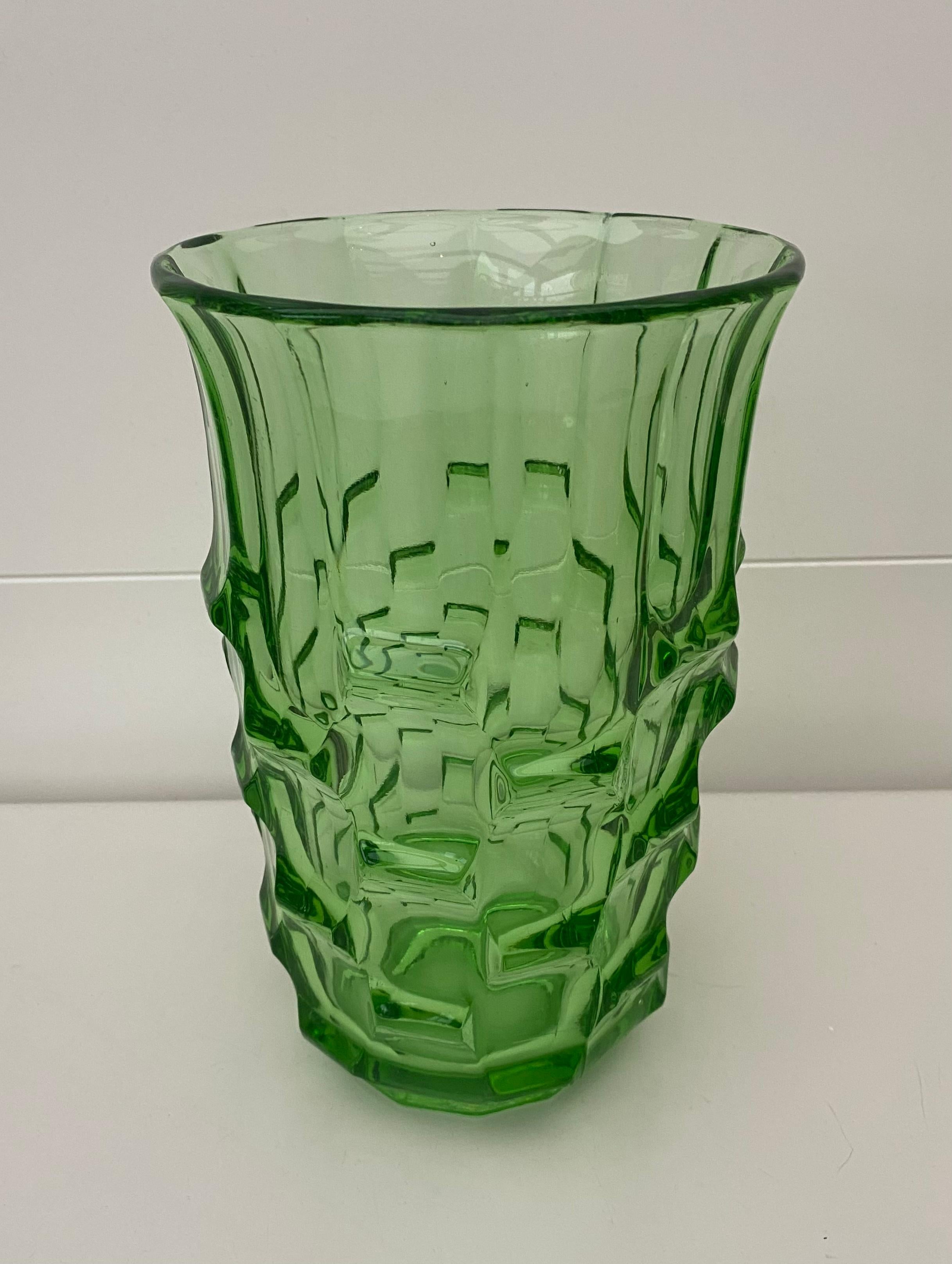 Striking green vase by August Walther & Söhne, Dresden, Germany, Ca. 1936. This bright shining green vase features magnificent graphic decoration and remains in stunning condition for it’s age. The piece will draw the attention in any room.