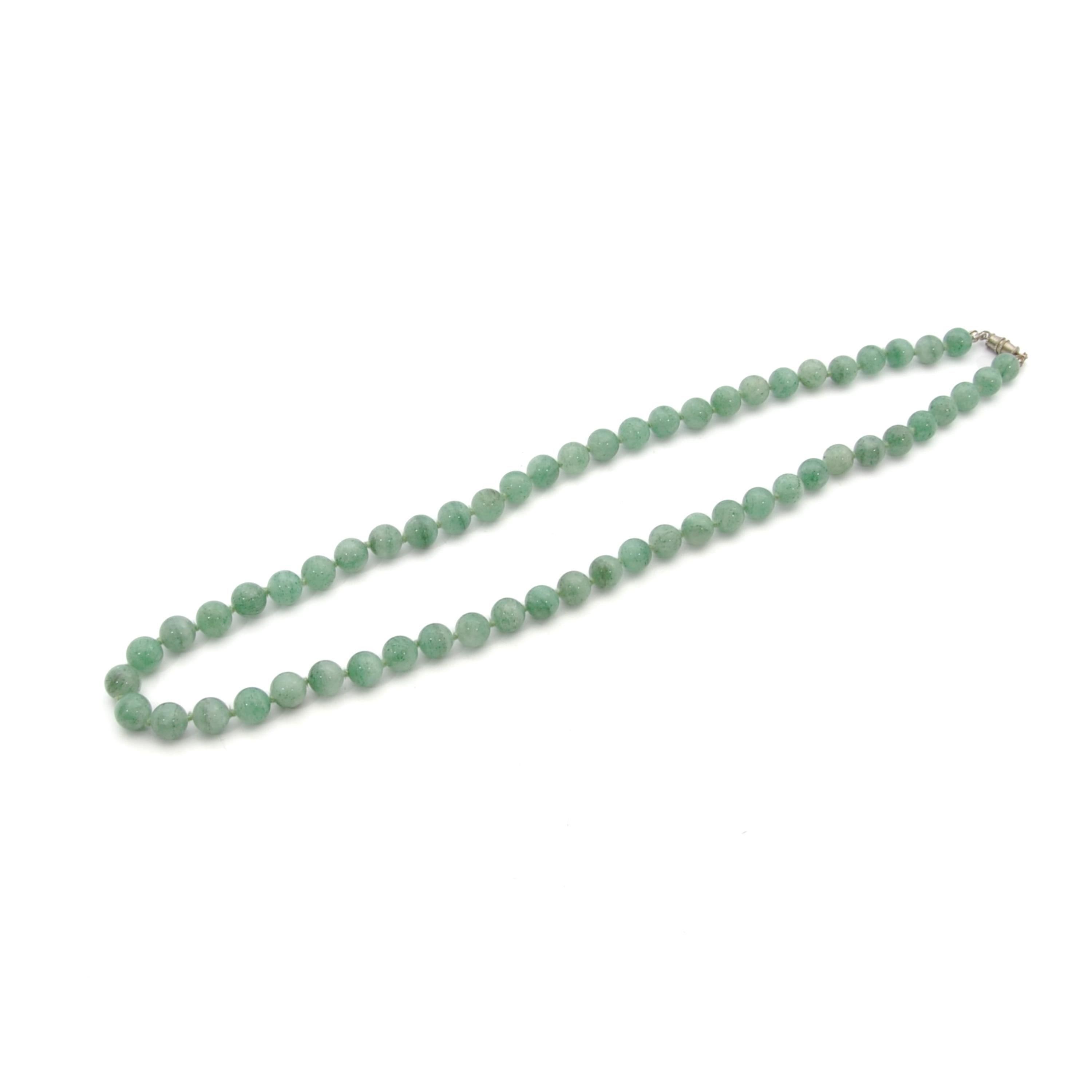 A beautiful polished natural green silky glow aventurine beaded necklace. Aventurine is an eye-catching crystal that is adored by many for its beautiful shiny appearance. The presence of the mineral fuchsite gives aventurine its unique green tone