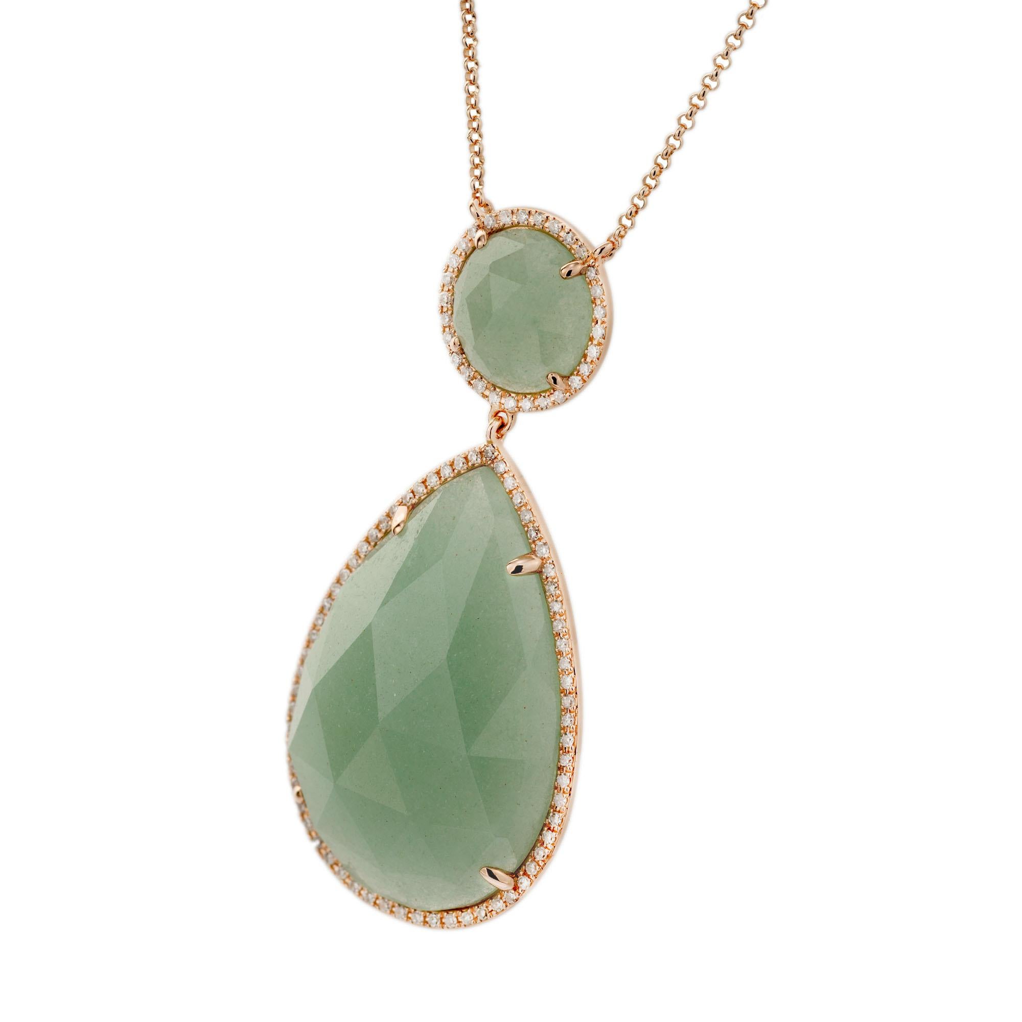 Aventurine and diamond pendant necklace. Pear and round shaped quartz, each with a halo of micro pave diamonds set in 14k Rose gold. 18 Inches long with shortening links.

1 pear shaped faceted cabochon green aventurine quartz, 27.4 x 18.4 x 6
1