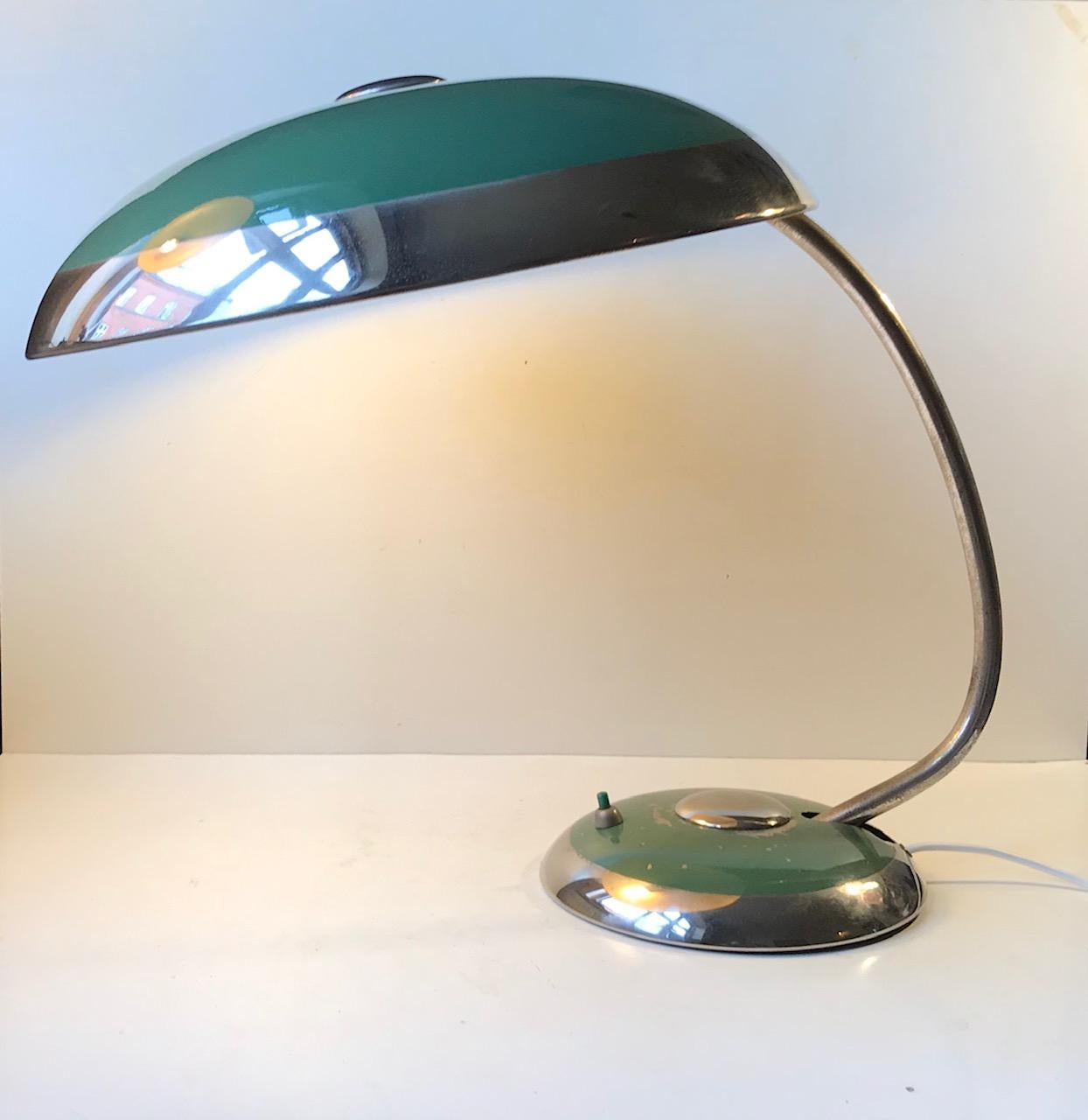 Original unrestored Bauhaus desk/table lamp by Helo Leuchten. 
Beautiful green exterior with accents in polished aluminum. This version of the large Helo's are by far the rarest as most of them were made with brass accents. The stem is adjustable