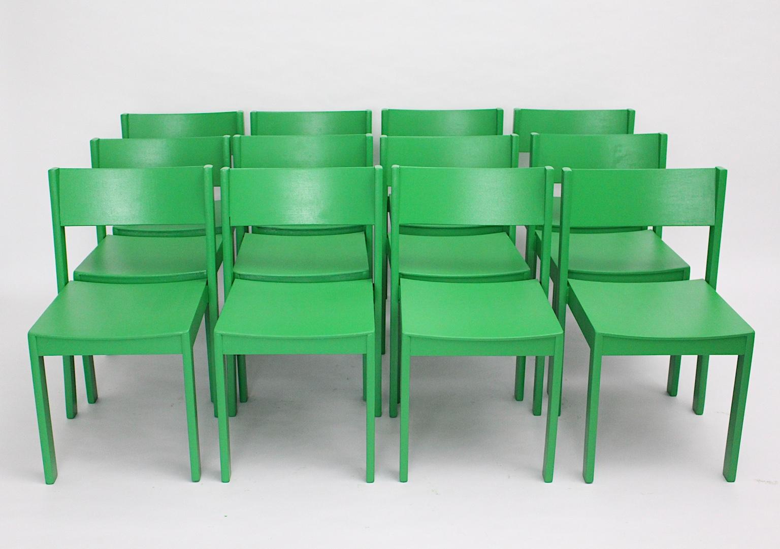 Mid Century Modern set of 12 green vintage Mid-Century Modern dining chairs designed and manufactured 1950s in Austria.
The vintage dining chairs were made out of beech and plywood, while the surface is carefully cleaned and newly green lacquered.