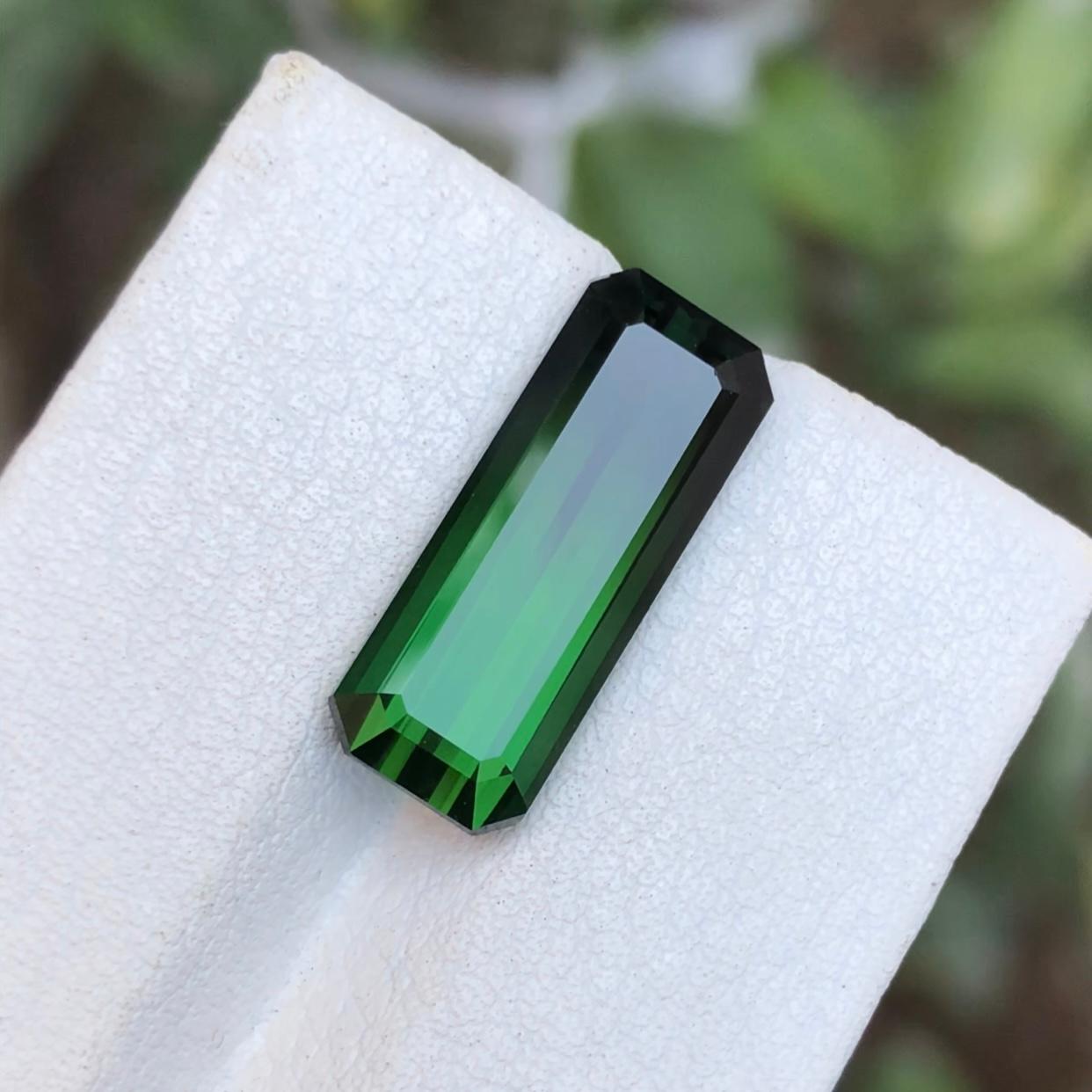 GEMSTONE TYPE: Tourmaline
PIECE(S): 1
WEIGHT: 7.35 Carats
SHAPE: Emerald Cut
SIZE (MM):  18.08 x 7.08 x 5.88
COLOR: Green & Black Bicolor
CLARITY: Eye Clean
TREATMENT: None
ORIGIN: Afghanistan
CERTIFICATE: On demand

This 7.35 carat natural