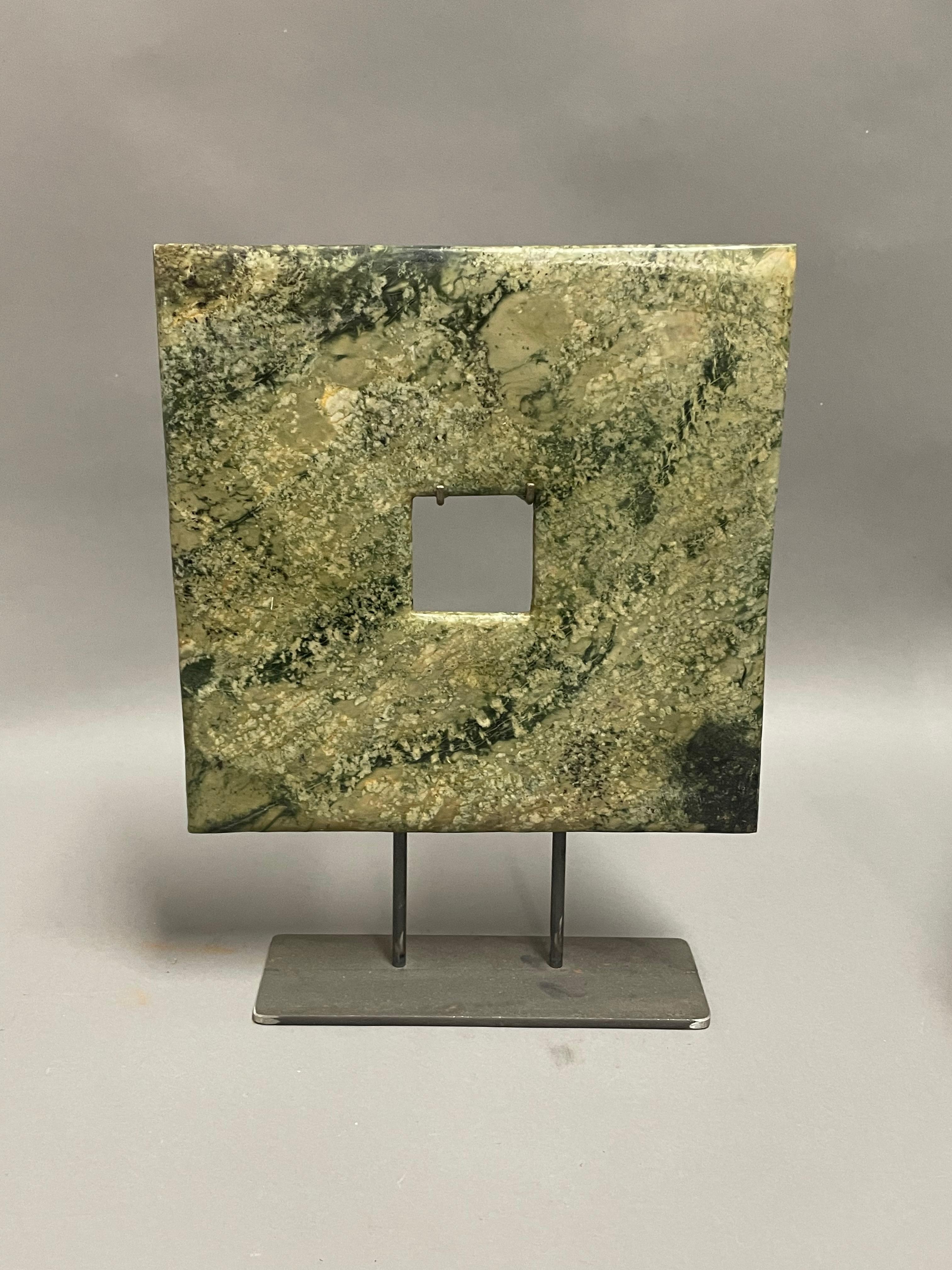 Contemporary Chinese set of three square and rectangular shaped jade discs.
Small square disc measures 6d  x  8.5h     stand measures  6  x  2
Large square disc measures 10d  x  13h    stand measures  8  x  3
Rectangular disc measures   12d  x  9.5h