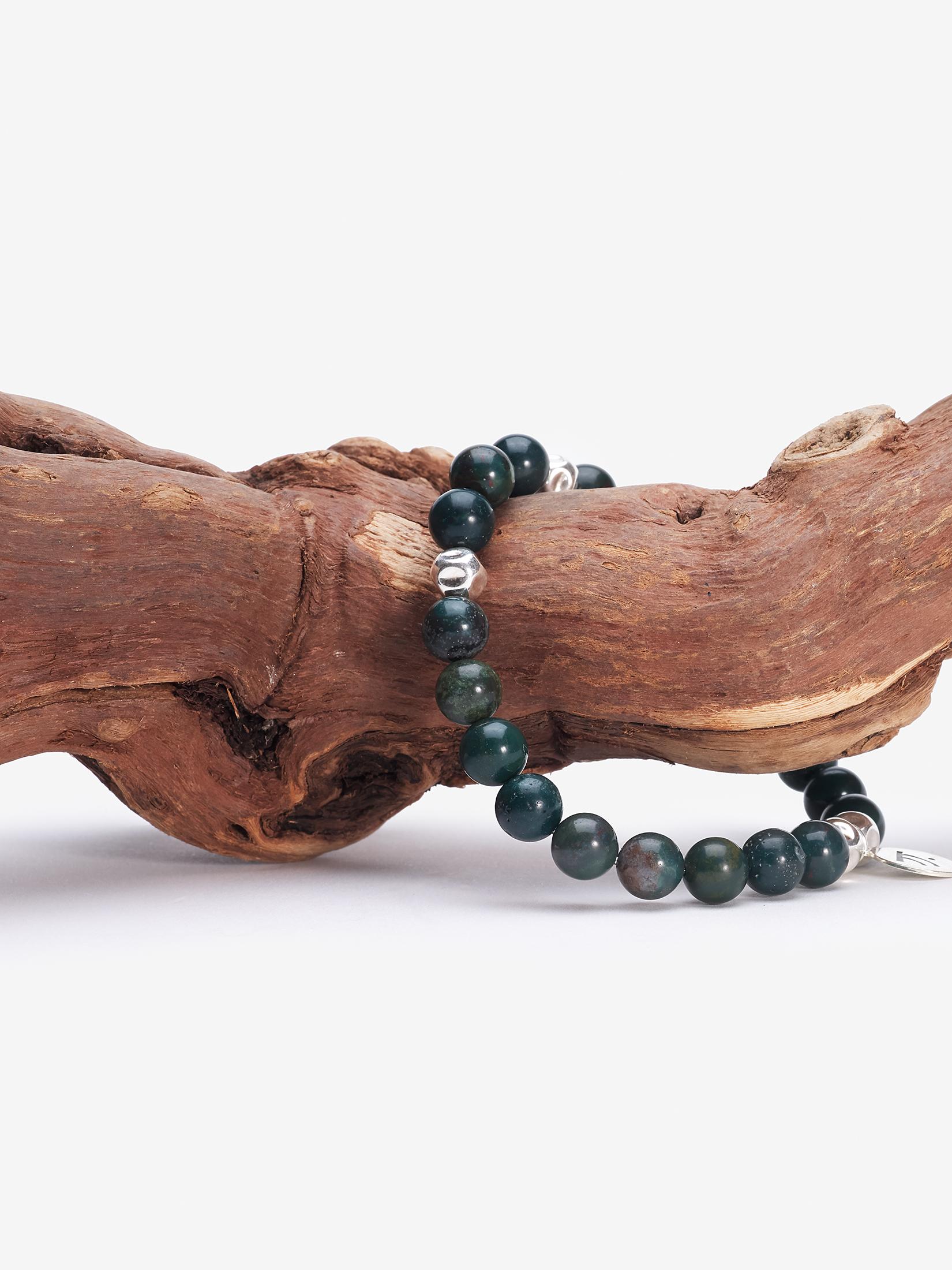green and black beads meaning