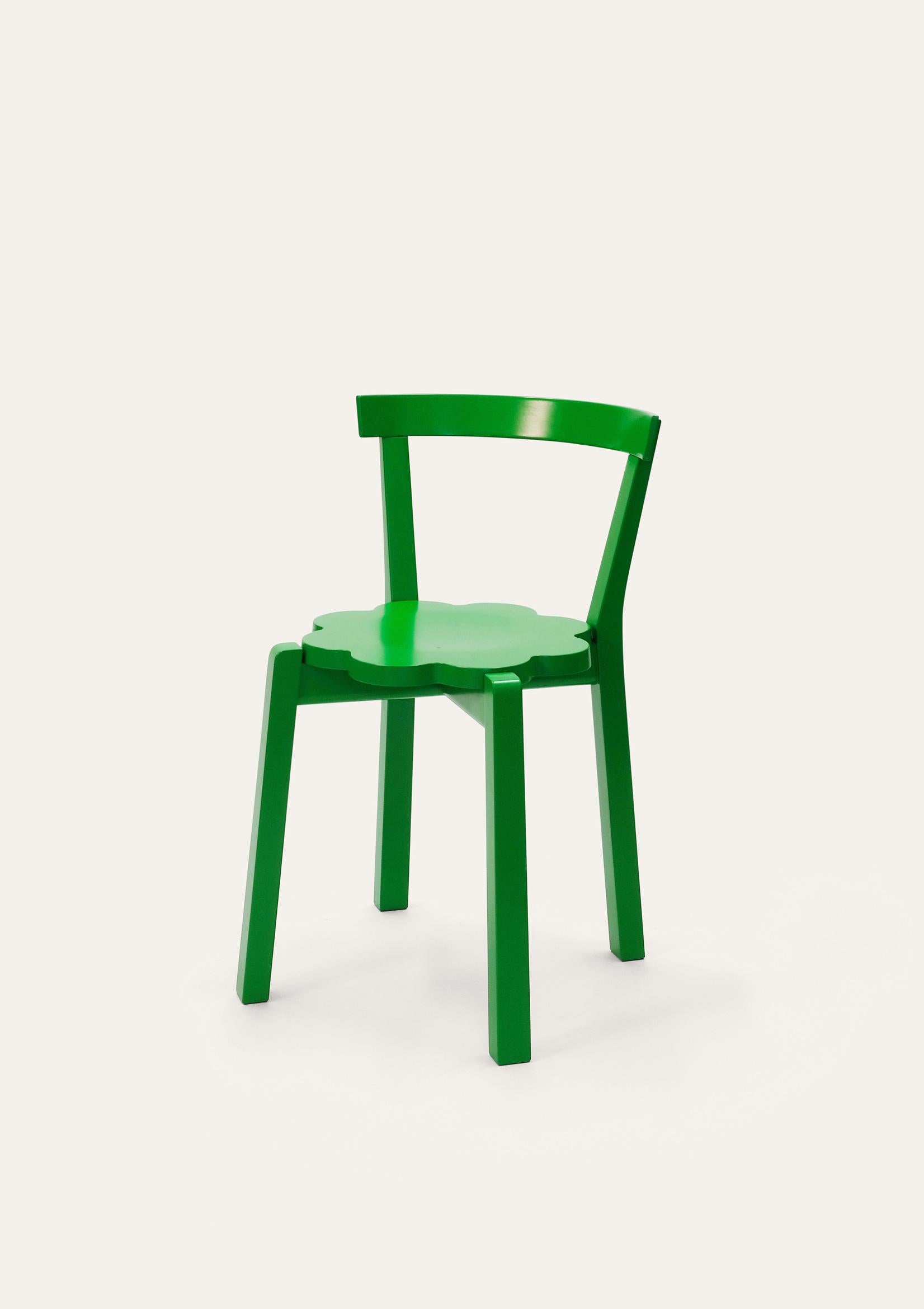 Green blossom chair by Storängen Design
Dimensions: D 46 x W 41 x H 72 x SH 45cm
Materials: birch wood.
Available in other colors and sizes.

A small and neat stackable chair, which works well round tables in cafes and living rooms.
A clean