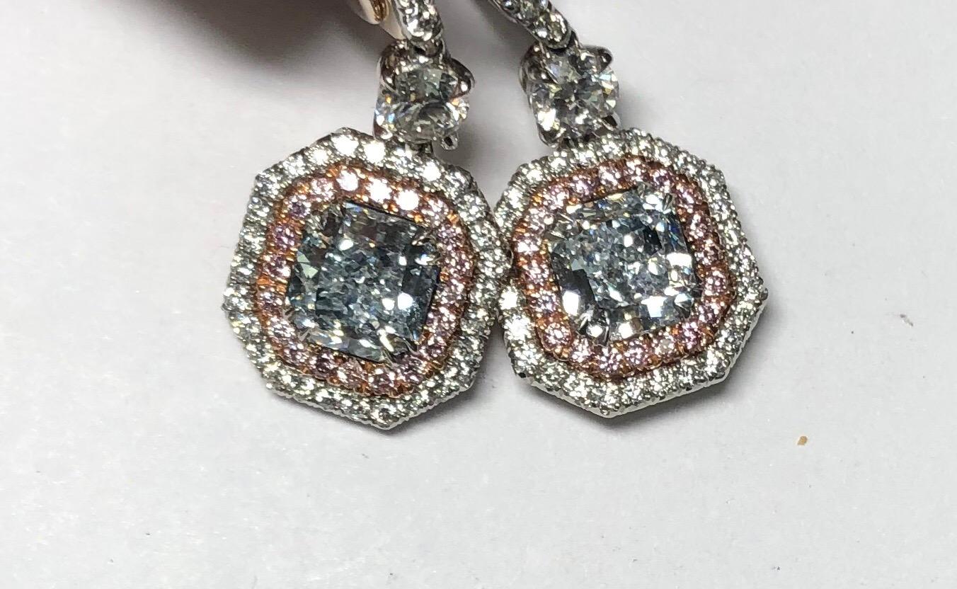 Gorgeous Light Greenish Blue Radiant Cut Diamond earrings featuring center diamonds of .76 and .79 carats VS clarity surrounded with white and pink diamond frames in Platinum. Beautiful and wearable, please inquire for additional details and GIA