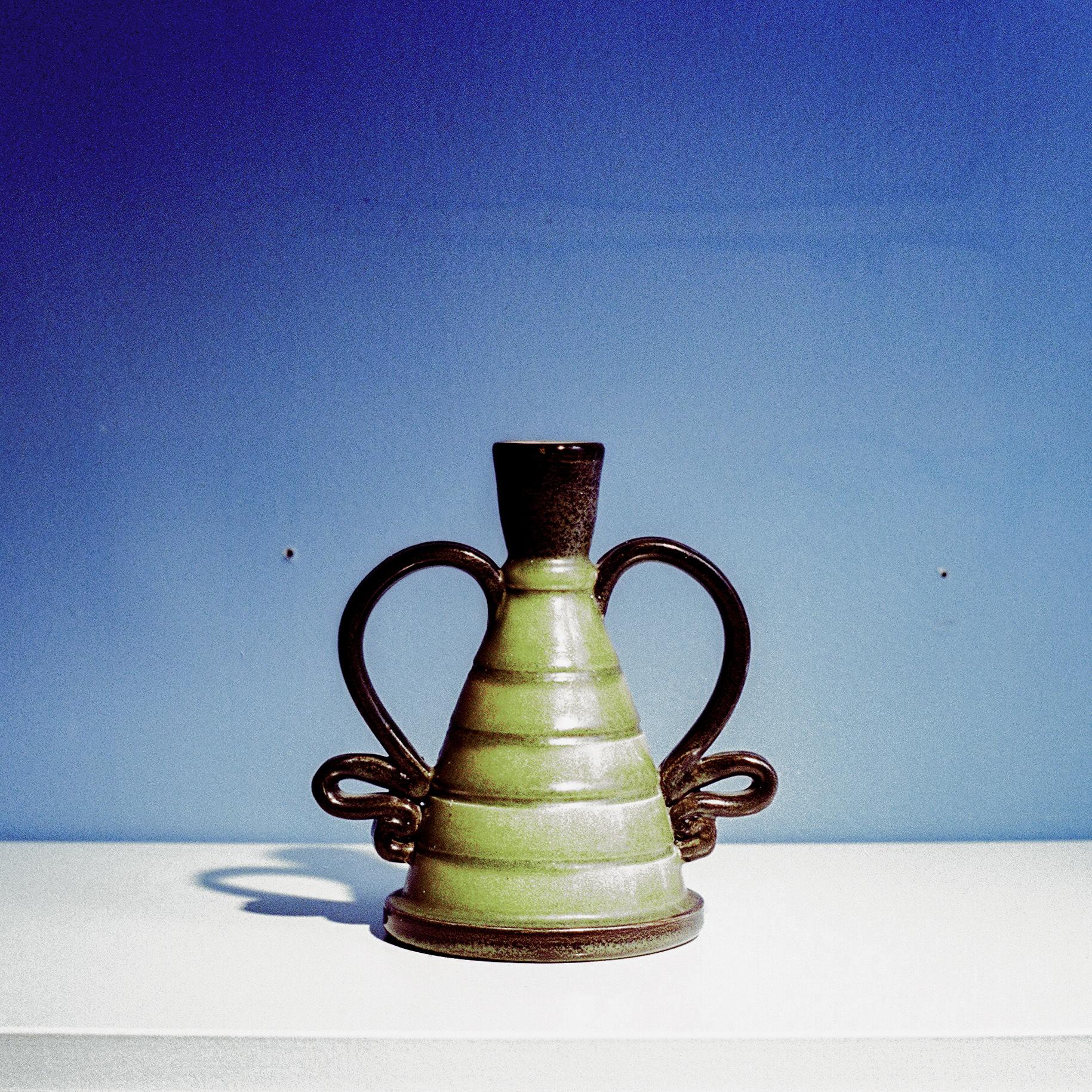 Ceramic Vase/Candle Holder by Eva Jancke-Björk for Uppsala Ekeby, Sweden, c. 1940

Unique, sculptural glazed ceramic vase by Eva Jancke-Björk. Hand formed and glazed with lime and forest green stripes, emphasized with grey-black glaze.

Materials: