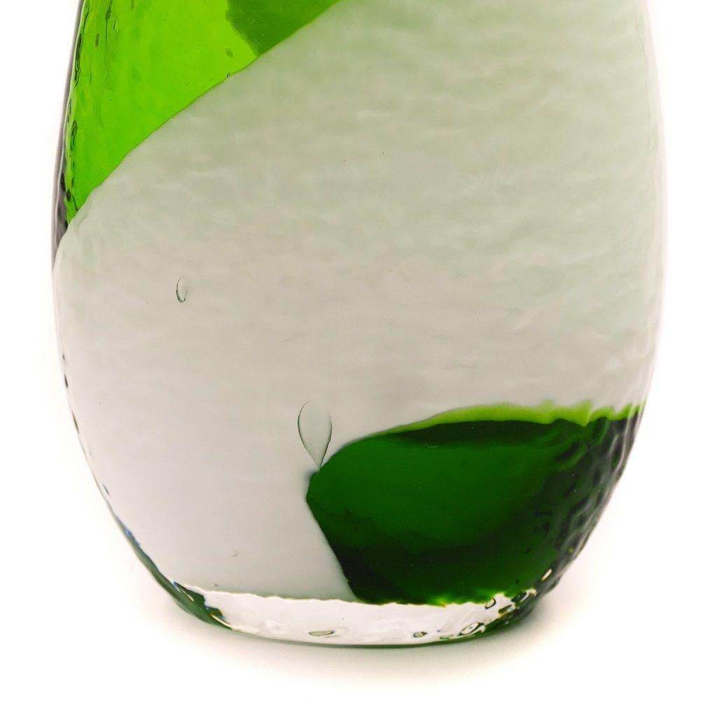 This green Bohemian glass vase is a decorative glass object manufactured in the 1960s.

Beautifully colored green and white.

Dimensions: cm 18 x 11.

In excellent conditions, as good as new.

This superb and very precious item was realized