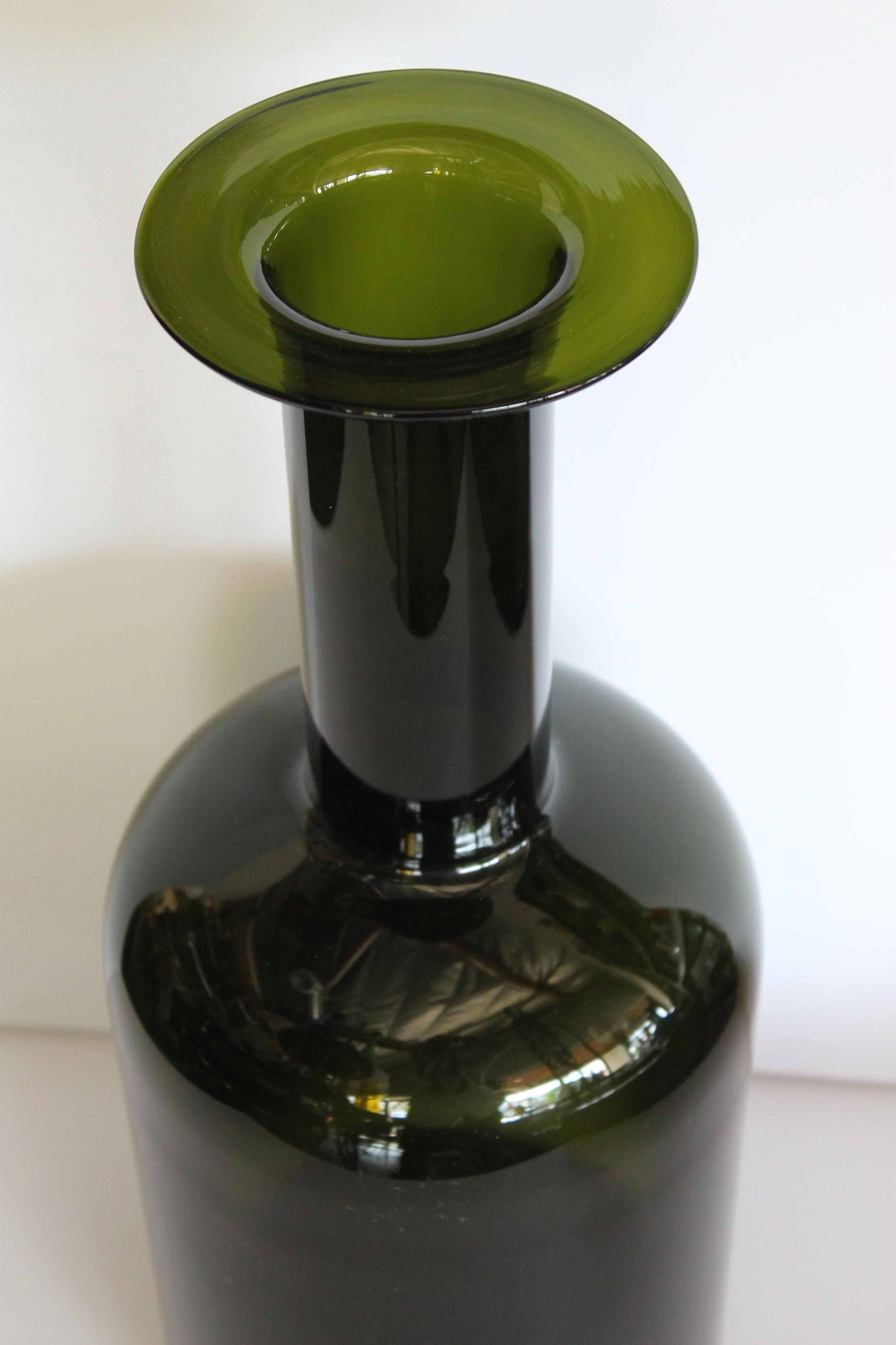 Green bottle by Otto Bauer for Holmegaard. Bottle measures 17.5