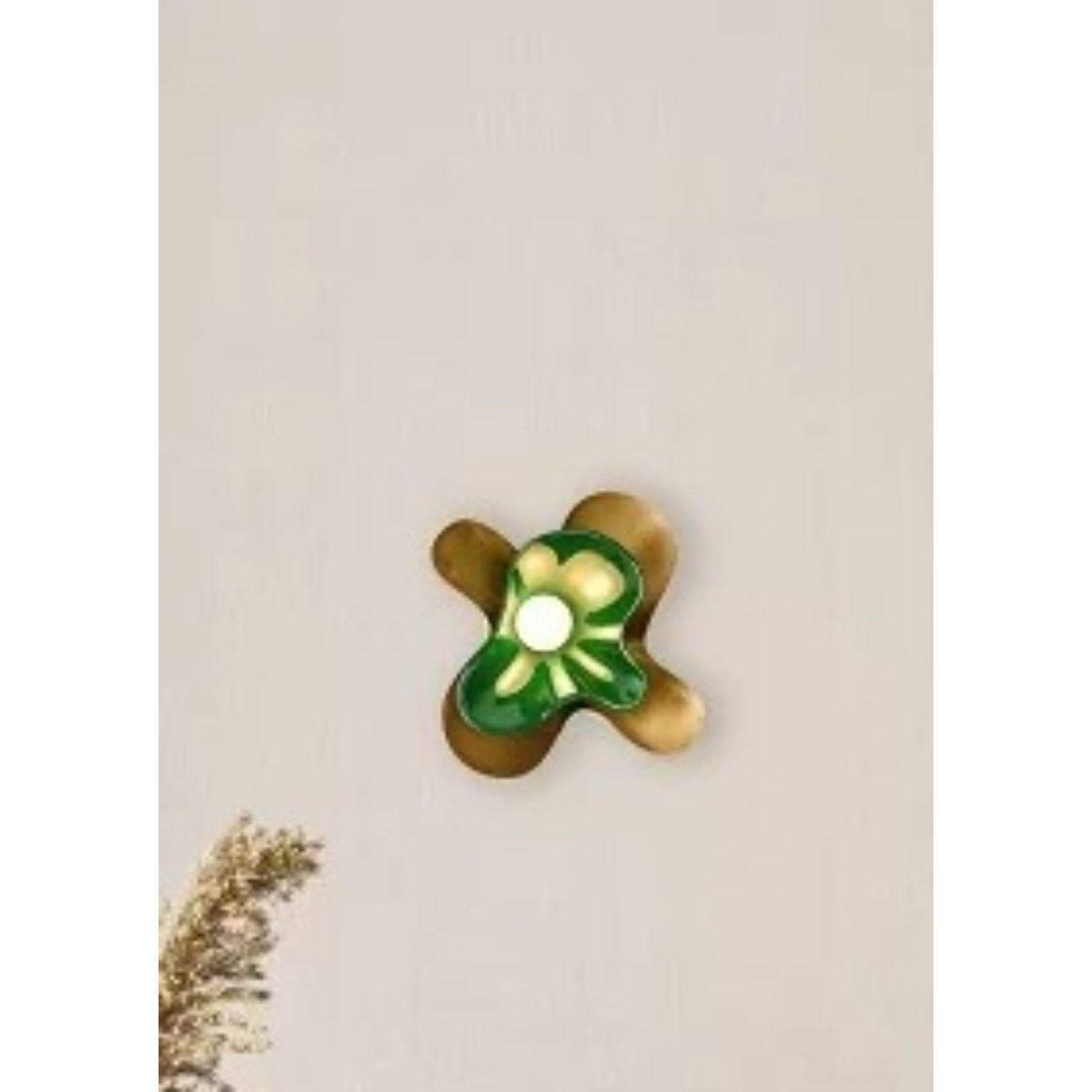 Green Butterfly Wall Sconce by Dainte
Dimensions: D 13.5 x W 28.5 x H 28 cm.
Materials: Glass and brass. 

The Butterfly wall sconce features an elegant silhouette modeled after the wings of a butterfly in motion. Layered textured brass and glass, a
