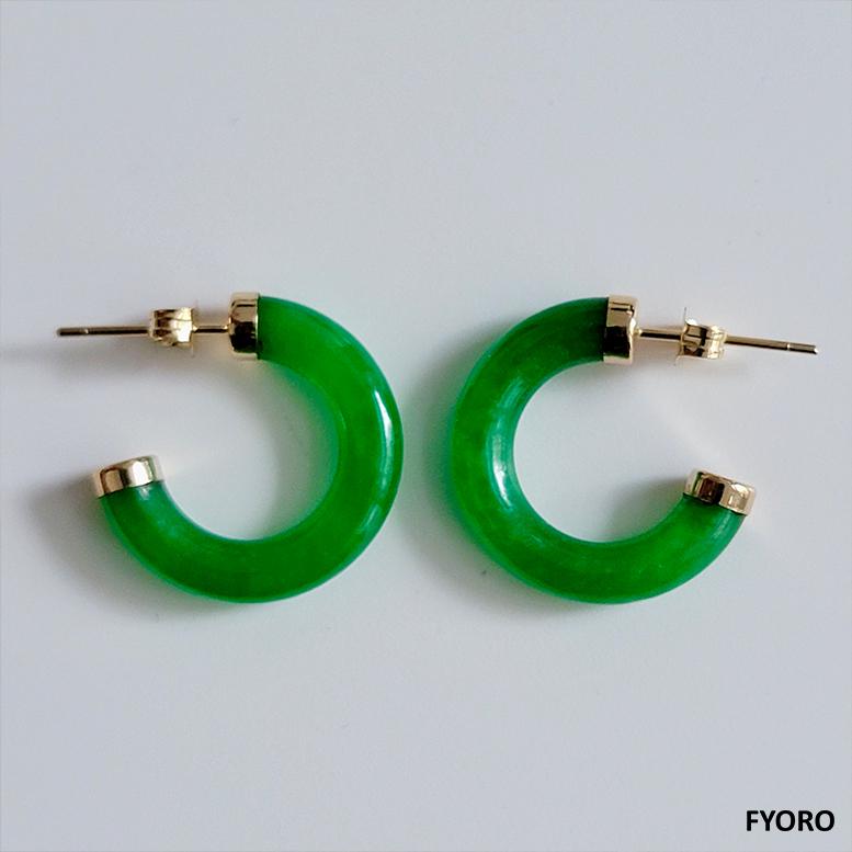 The 'C-Hoop Jade Earrings' uses a unique curved shape to show the different angles, dispersions and absorptions of light within jade. It's sleek curves truly are a masterpiece.

Made out of Jadeite, with solid 14K Yellow Gold hoop back to accentuate