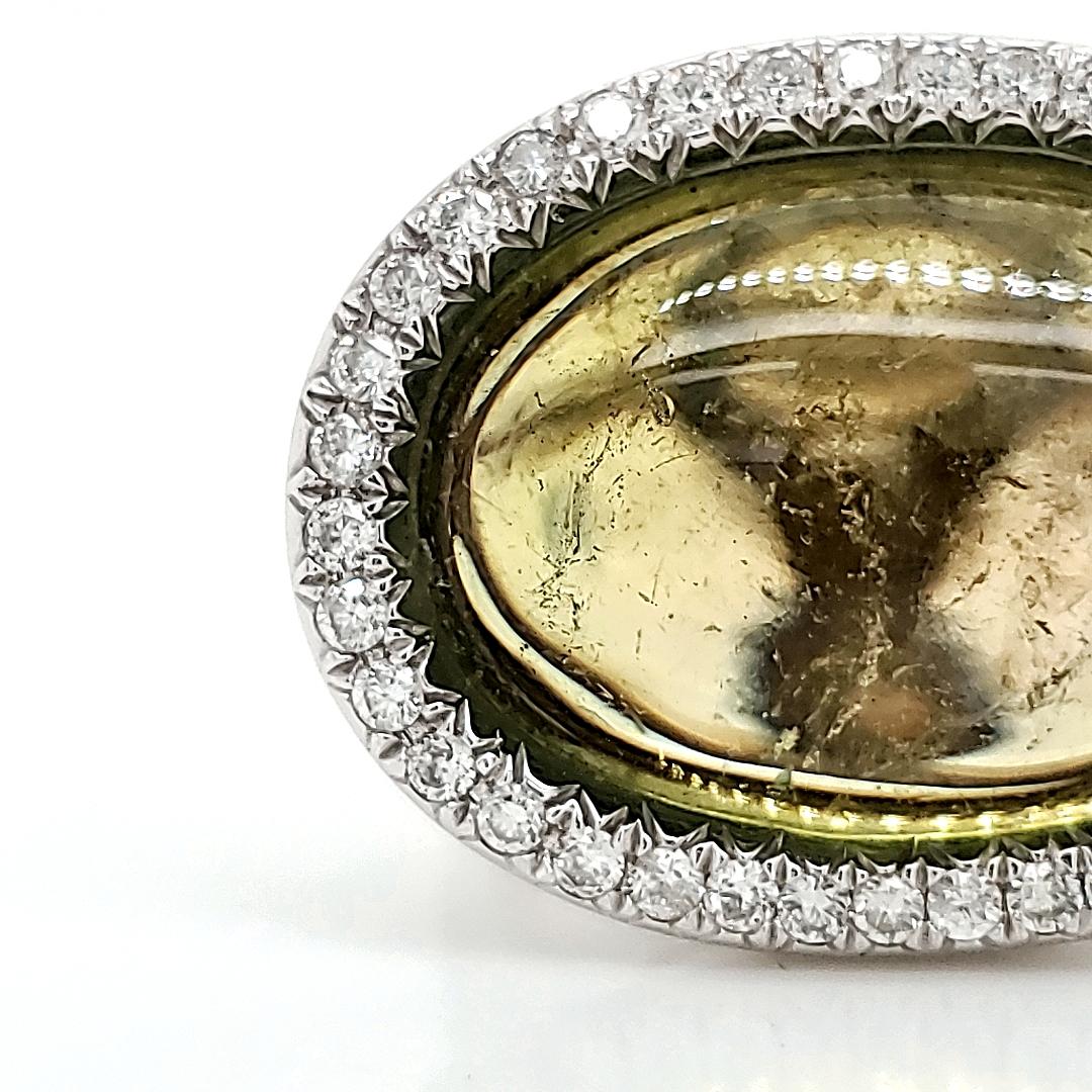Adorn yourself with luxury and rarity through our exquisite Green Cab Tourmaline Ring.

The centerpiece features a captivating 15.51-carat Green Cab Tourmaline, renowned for its remarkable color and rarity.

Encircled by 38 diamonds totaling 0.48
