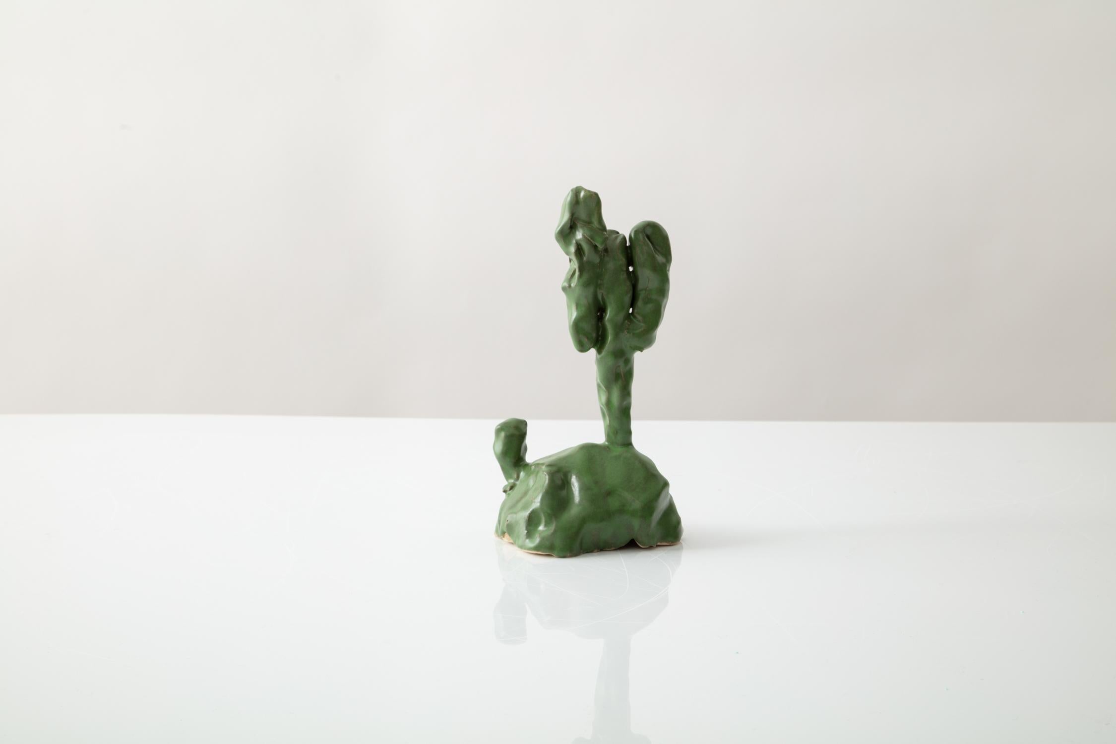Keith Simpson rather instinctively made ceramic cacti for the show. They were a last minute thought that evolved out of a daydream. Keith was musing about the possibility of moving to the desert and found himself thinking about large, friendly,