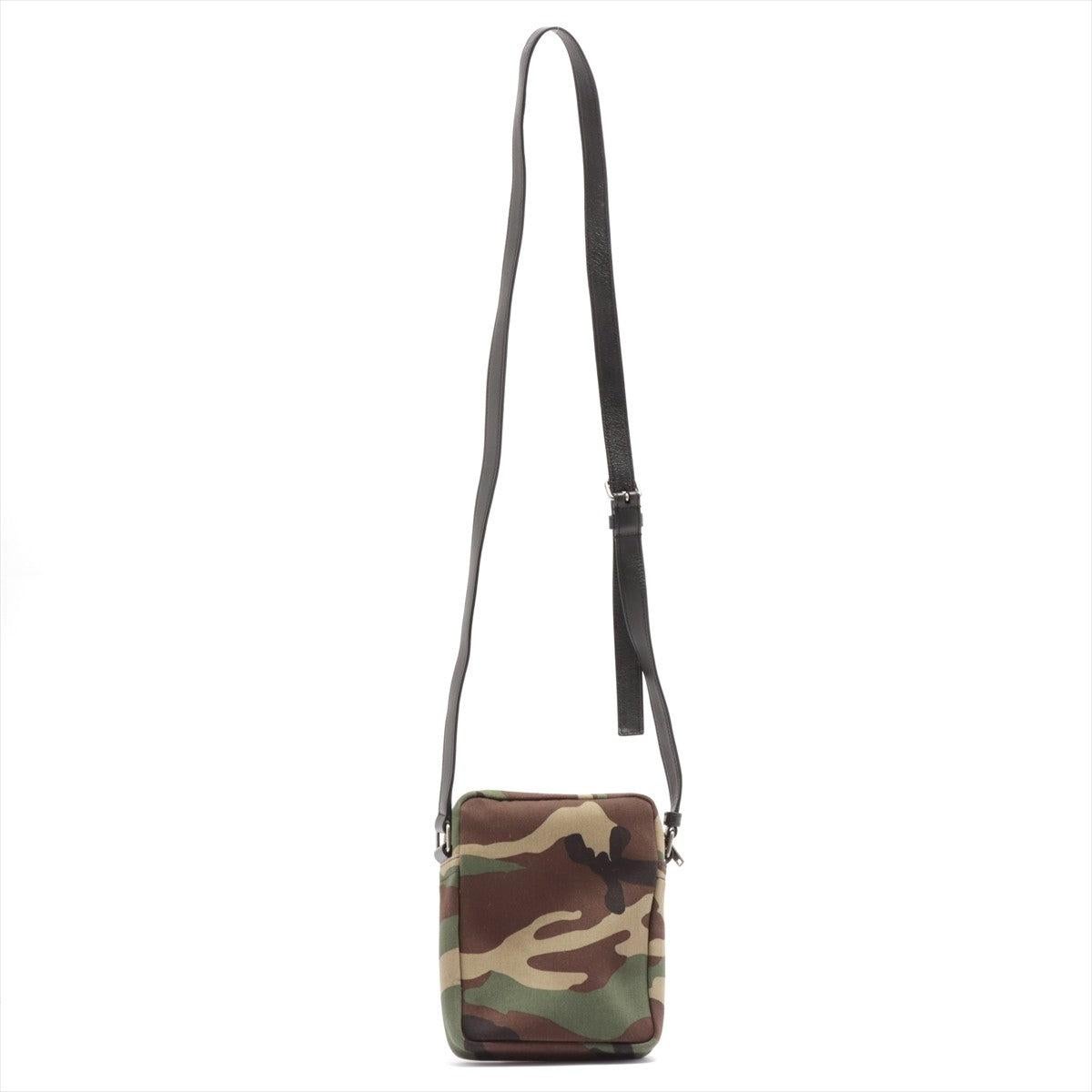 Green Camouflage printed canvas Saint Laurent Sacoche bag with silver-tone hardware, black leather adjustable shoulder strap, front pocket with zip closure, black nylon lining, one flat pocket inside the main compartment and zip closure at