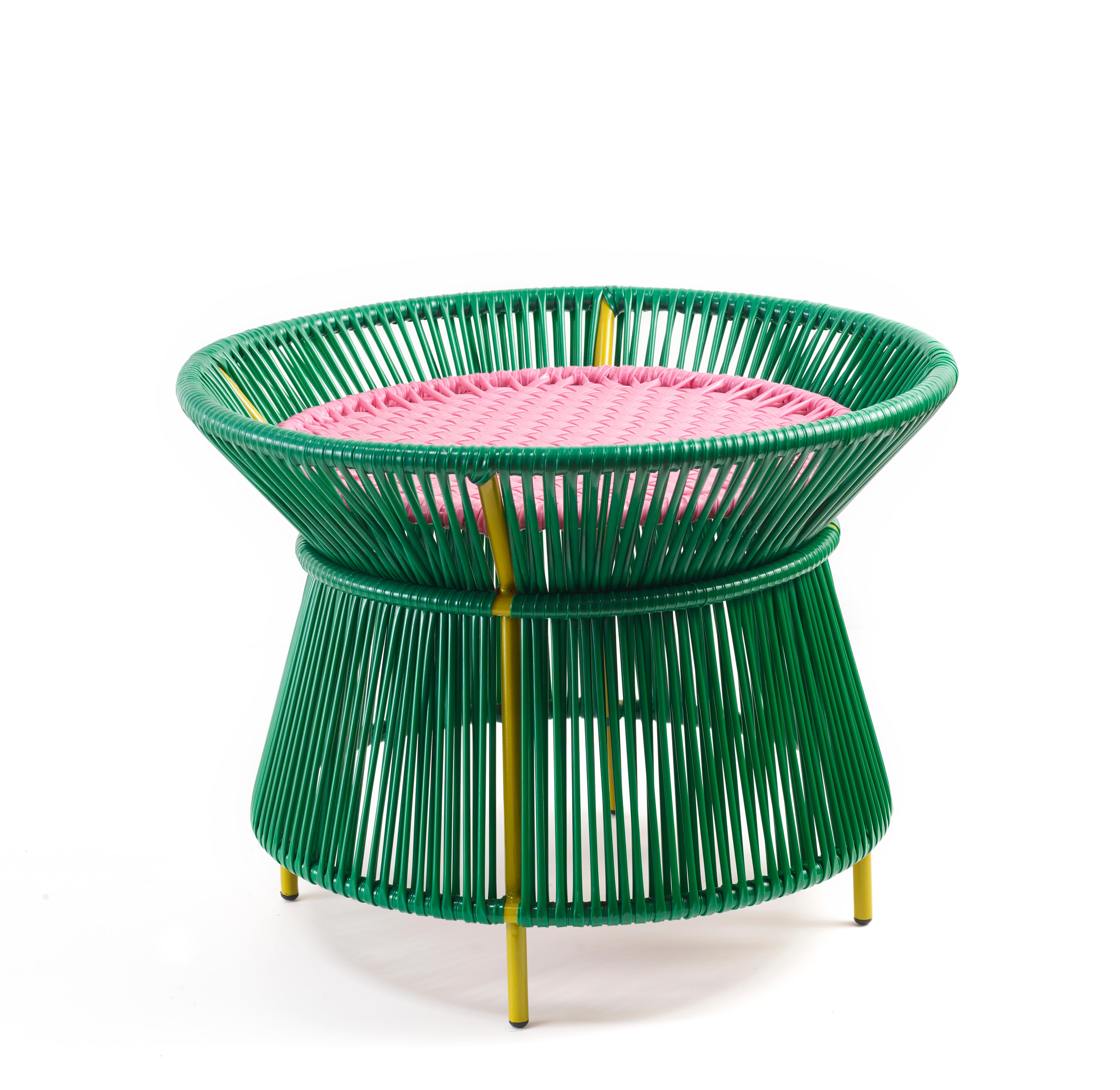 Green caribe basket table by Sebastian Herkner.
Materials: Galvanized and powder-coated tubular steel. PVC strings are made from recycled plastic.
Technique: Made from recycled plastic and weaved by local craftspeople in Colombia. 
Dimensions: