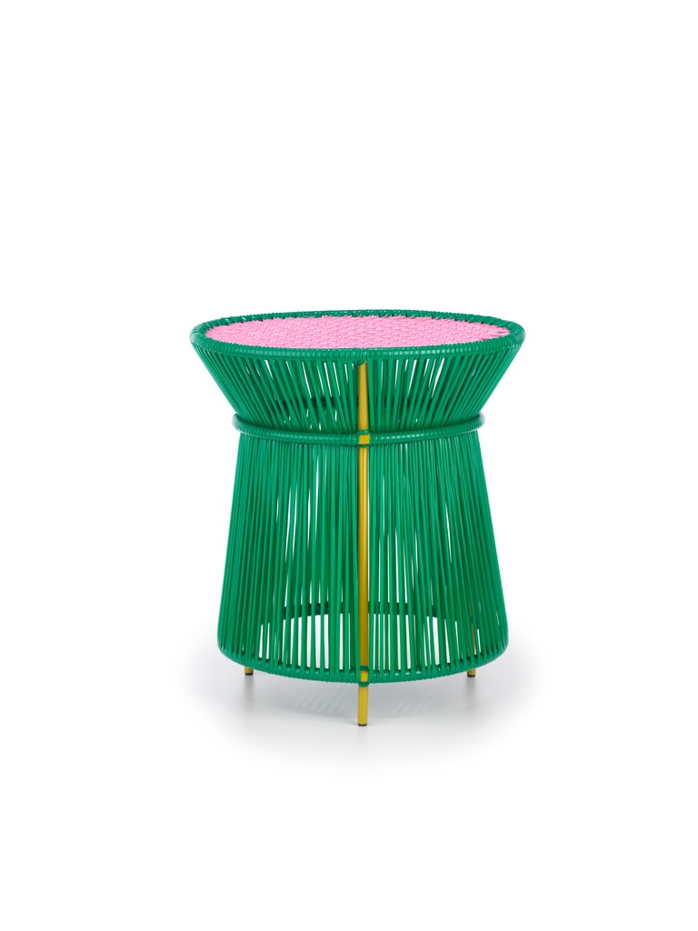 Green caribe high table by Sebastian Herkner
Materials: Galvanized and powder-coated tubular steel. PVC strings are made from recycled plastic.
Technique: Made from recycled plastic and weaved by local craftspeople in Colombia. 
Dimensions: