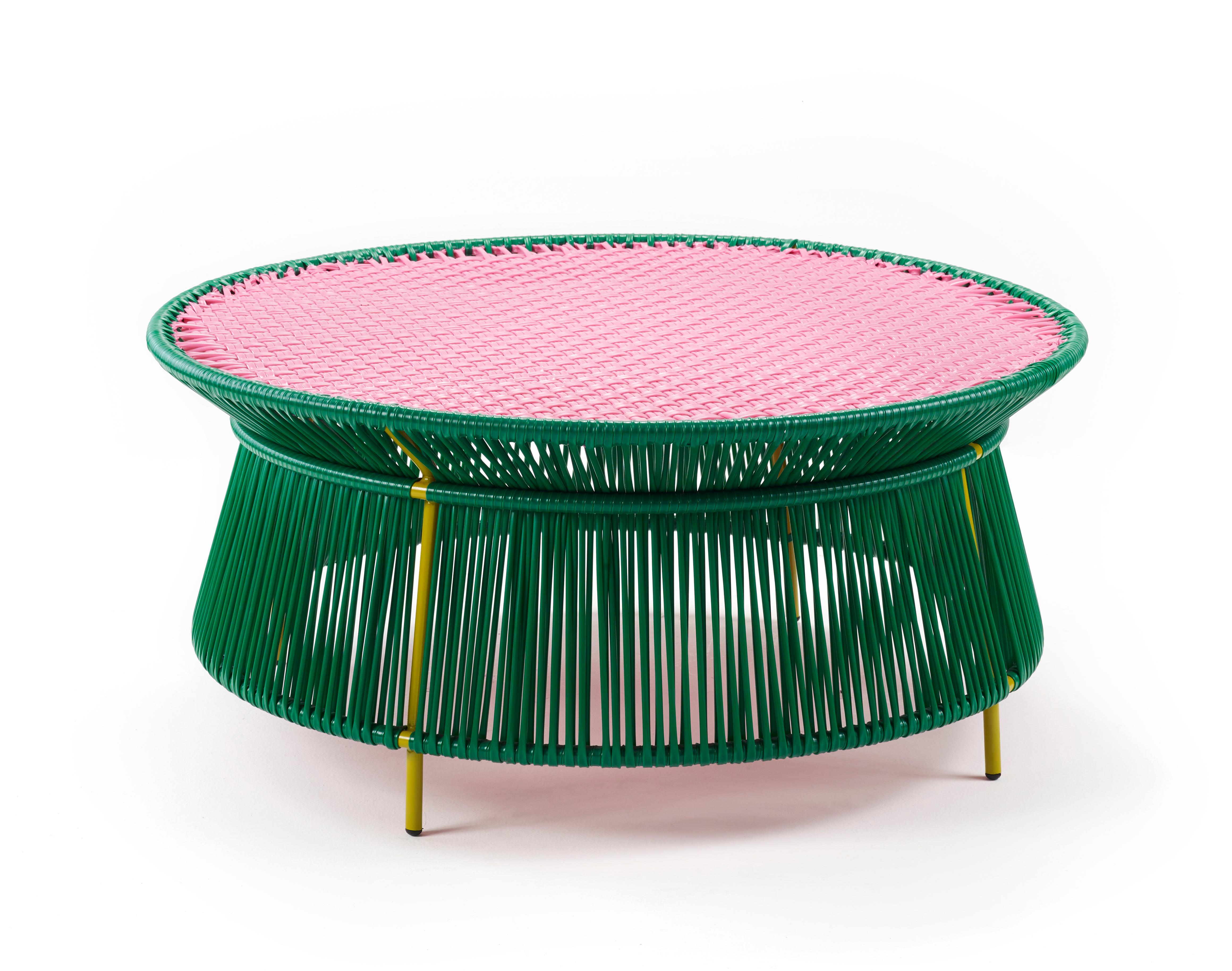 Green Caribe Low table by Sebastian Herkner
Materials: Galvanized and powder-coated tubular steel. PVC strings are made from recycled plastic.
Technique: Made from recycled plastic and weaved by local craftspeople in Colombia. 
Dimensions: