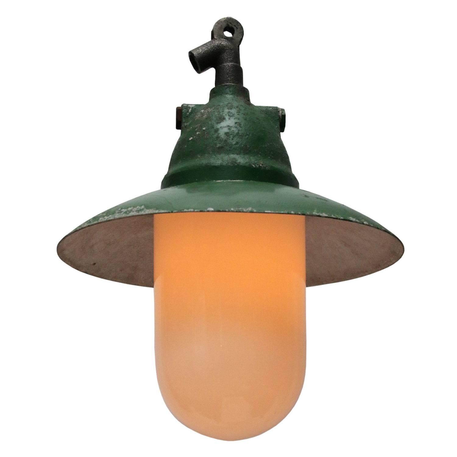 Industrial hanging lamp. Green cast aluminium.
White Opaline glass.

Weight: 3.6 kg / 7.9 lb

Priced individual item. All lamps have been made suitable by international standards for incandescent light bulbs, energy-efficient and LED bulbs. E26/E27