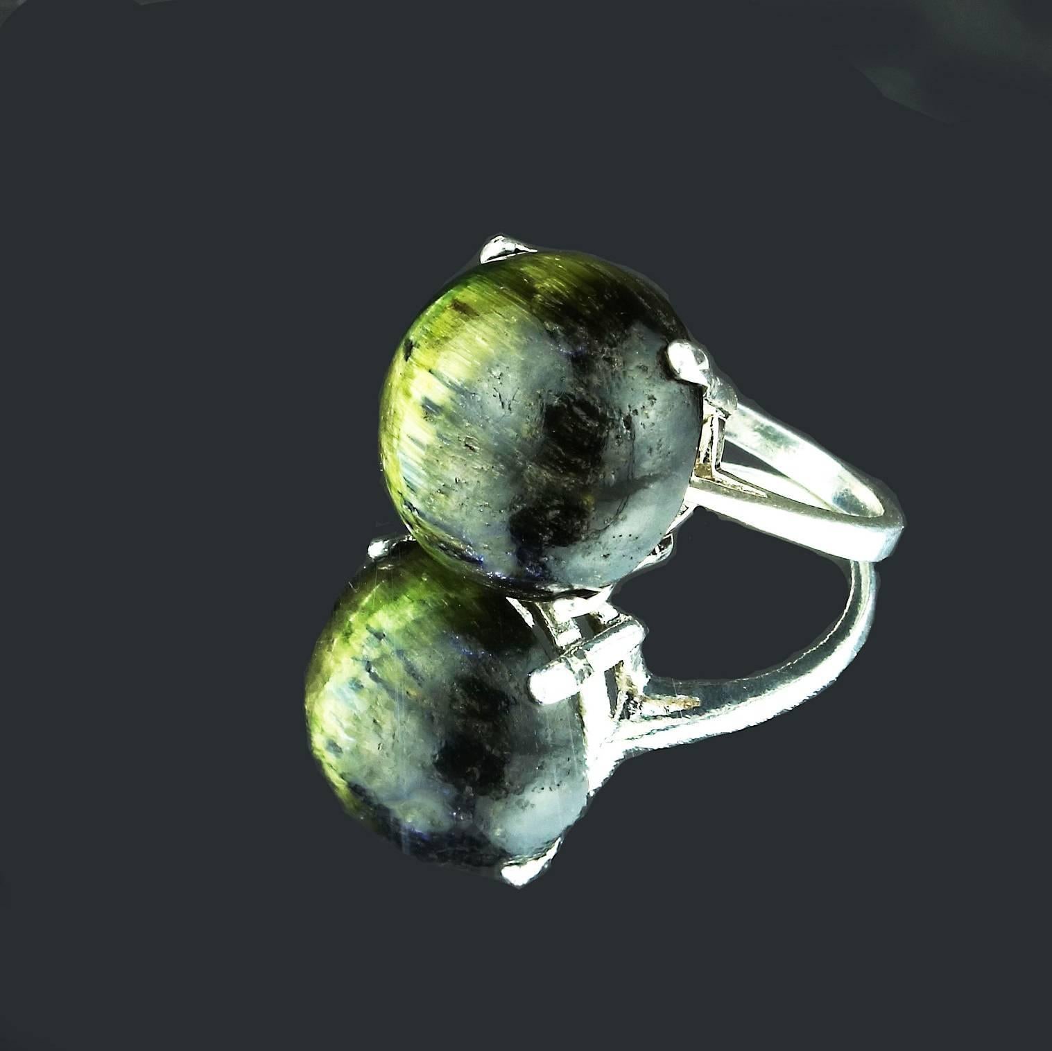 Custom made glorious, big, ring of 20.81 carats of green Chrome Diopside Cat's Eye to follow you around.  This is a great round cabochon dome seated in Sterling Silver. The ring is a sizable 6.25.  What a fun, playful everyday into evening ring to