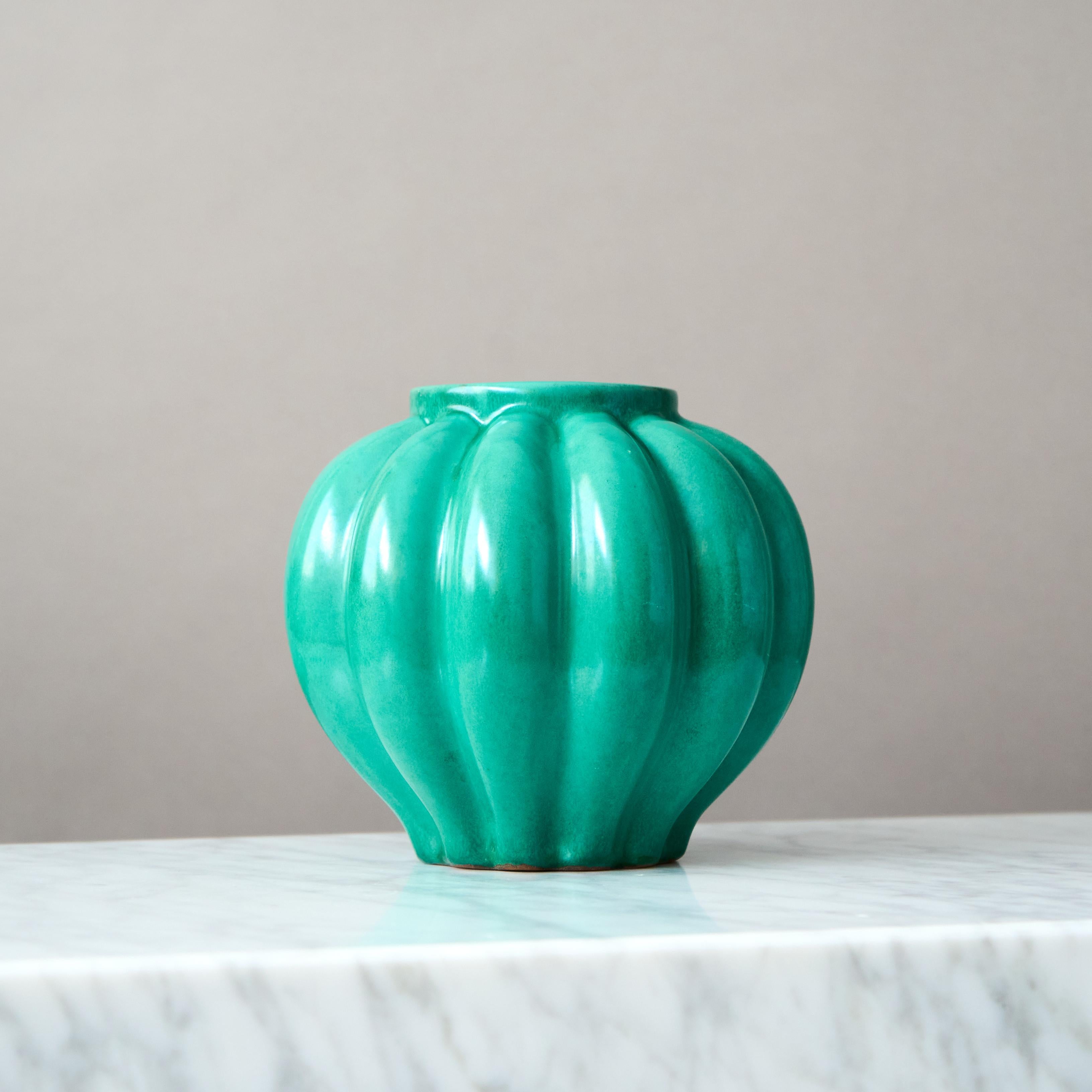 A beautiful Art Deco vase with amazing relief pattern.
Designed by Anna-Lisa Thomson for Upsala Ekeby, Sweden, 1930s.

Great condition. 

Anna-Lisa Thomson (1905-1952) was born in the southern Sweden town of Karlskrona. She received formal training