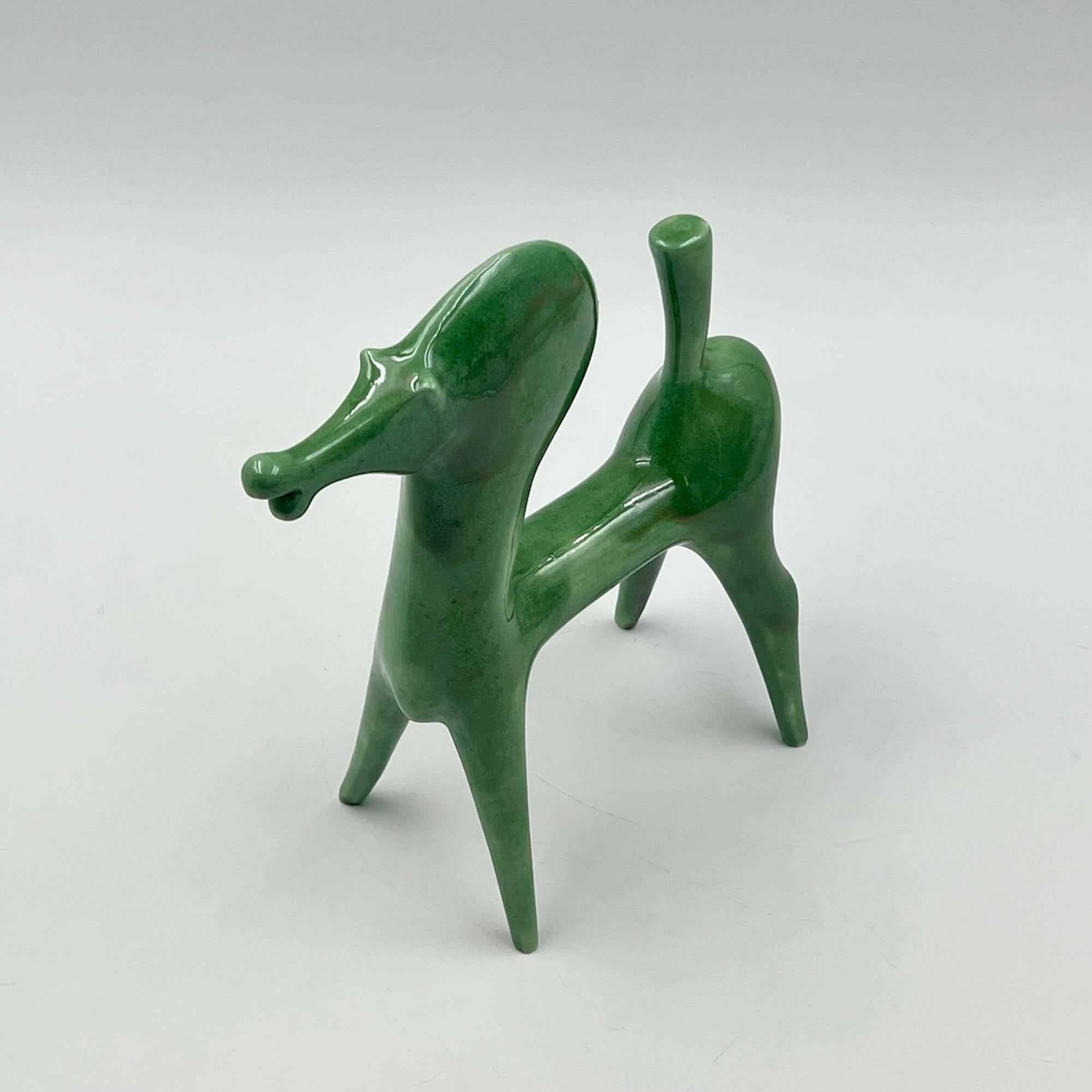 Discover a rare and captivating piece of 1970s art by renowned Italian artist Roberto Rigon. This exquisite green ceramic horse figurine epitomizes the unique charm and artistic flair that Rigon’s work is celebrated for. Crafted in Italy during the