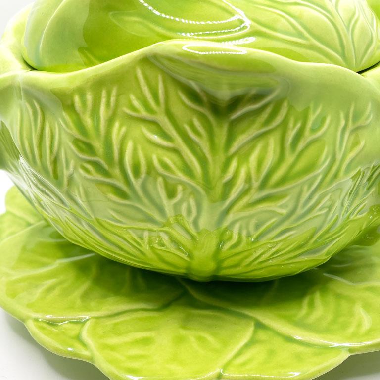 A bright green cabbage motif tureen with lid and serving saucer. This iconic pattern will be a great accent for your next dinner party. Slightly larger than a soup bowl, this piece will be great for serving smaller side dishes. 


 