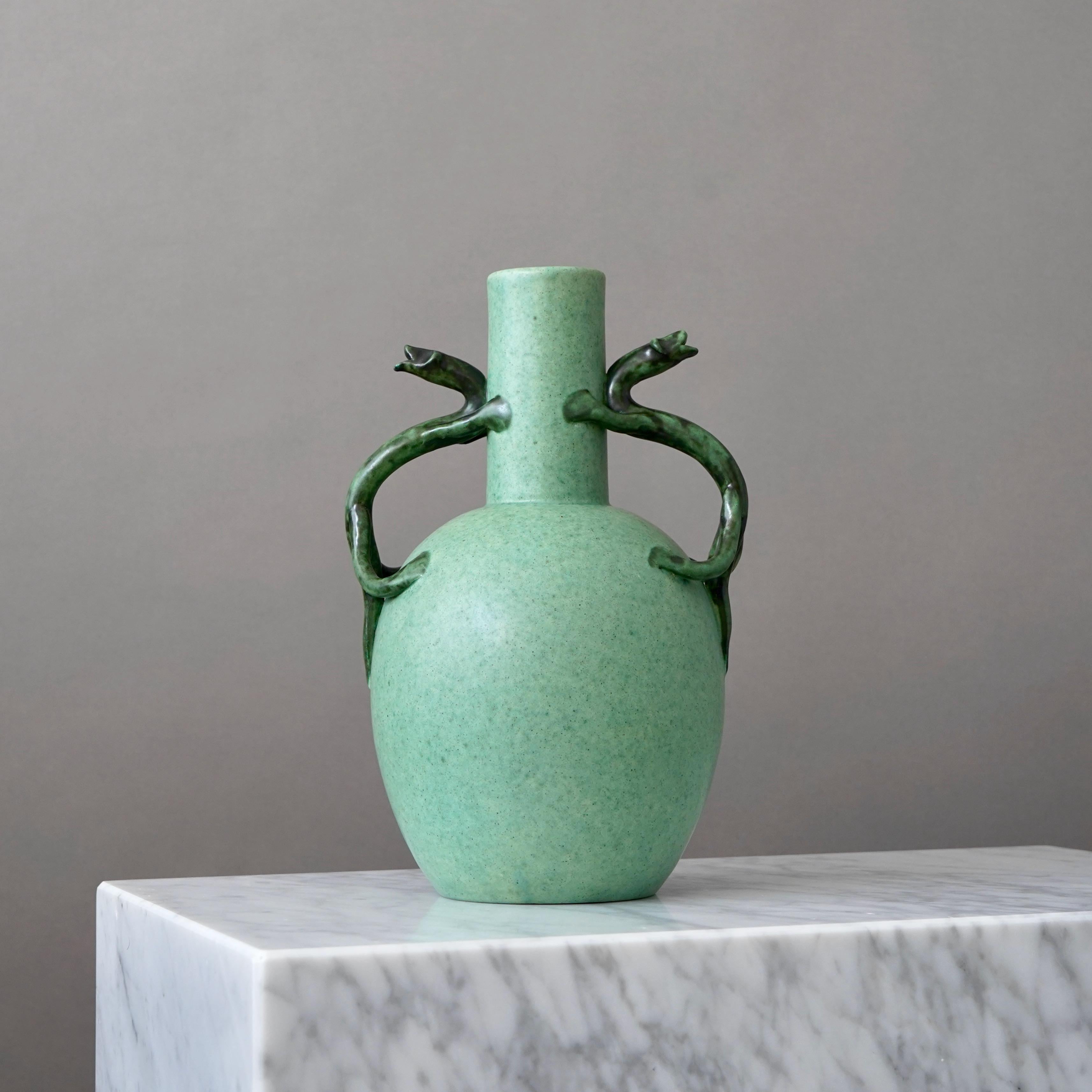 A beautiful Scandinavian Modern ceramic vase with amazing glaze. 
Designed by Eva Jancke-Björk for Bo Fajans, Sweden, 1940s.

Excellent condition. 
Makers marks on base of vase.

Eva Jancke-Björk (1882–1981) was a pioneering figure in Swedish