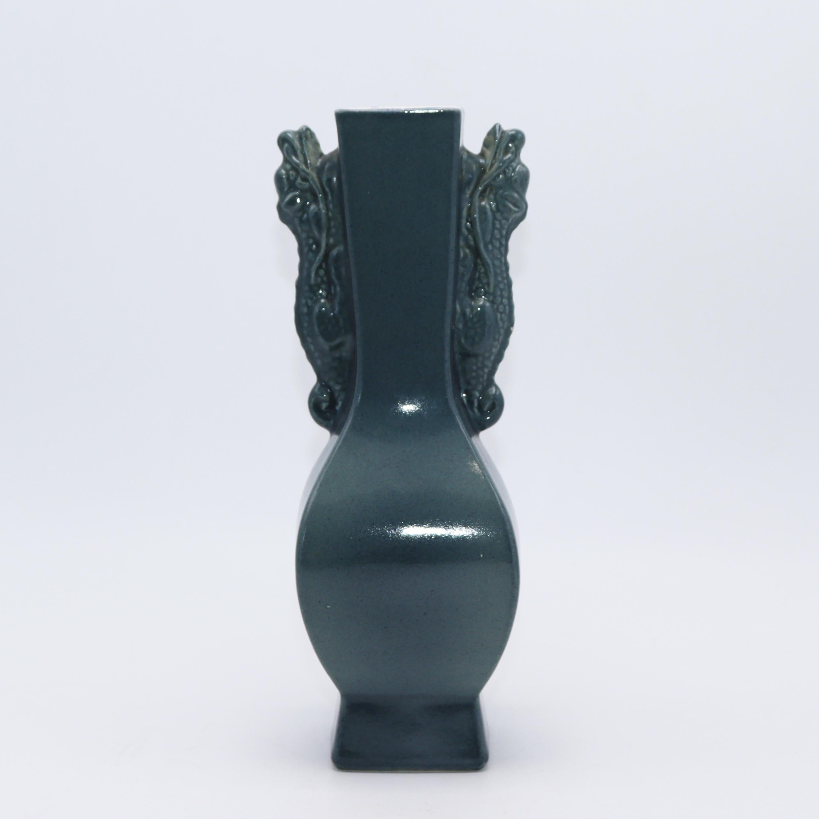 Green ceramic vase with dragons, c. 1960.