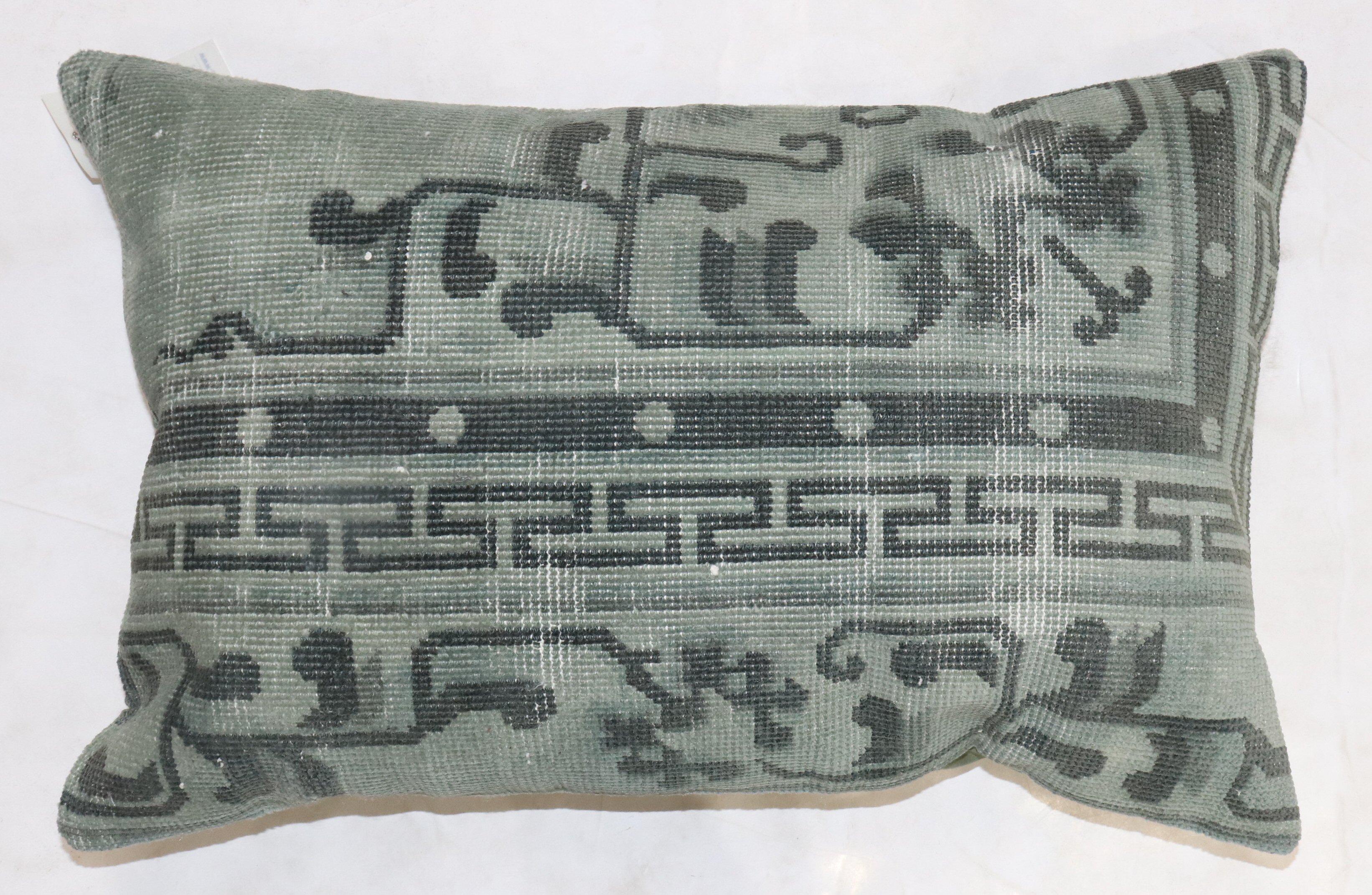Pillow made from an old Chinese rug predominantly in green. zipper closure and polyfill provided

Measures: 16'' x 23''.