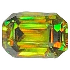 Green Chrome Sphene Gemstone: Lustrous Emerald Cut Titanite, 0.50 CT Green Chrome Sphene Gemstone: Lustrous Emerald Cut Titanite, 0.50 CT