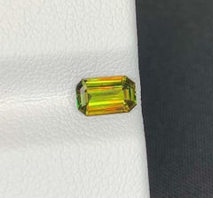 Green Chrome Sphene Gemstone: Lustrous Emerald Cut Titanite, 0.65 CT