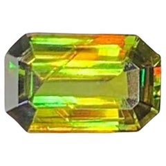Green Chrome Sphene Gemstone: Lustrous Emerald Cut Titanite, 0.65 CT Green Chrome Sphene Gemstone: Lustrous Emerald Cut Titanite, 0.65 CT