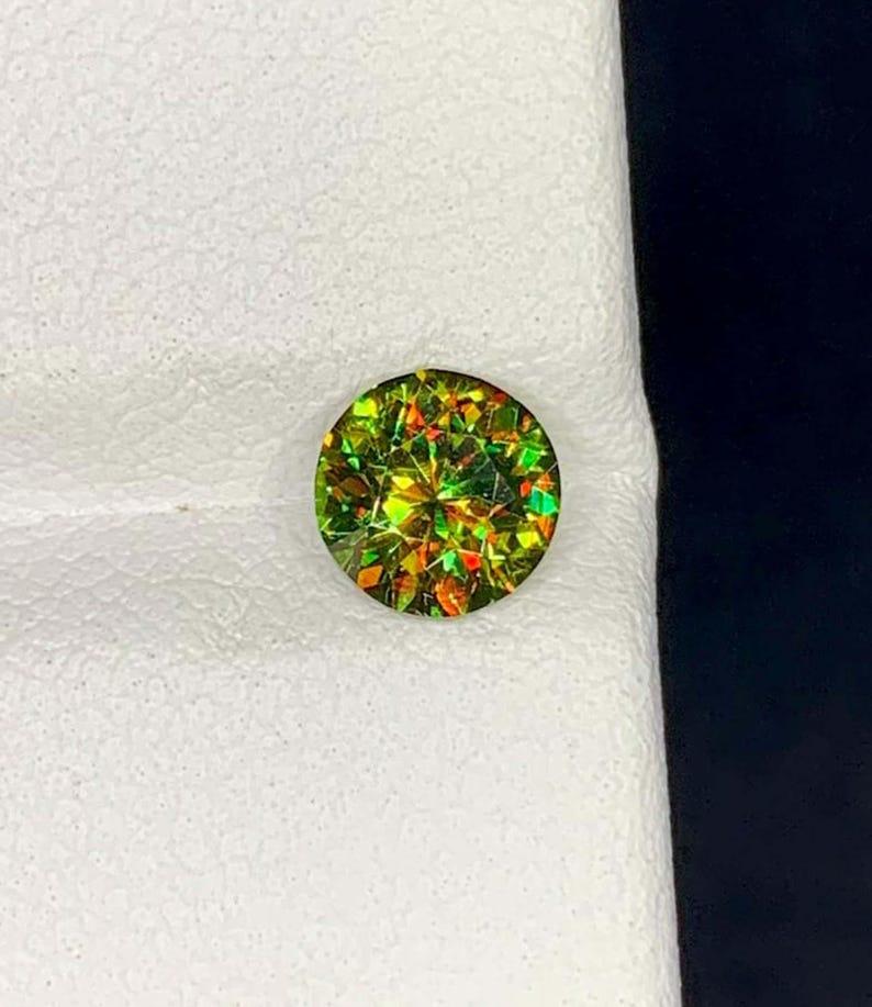 This stunning **green sphene** from Pakistan is an absolutely exhilarating gemstone, celebrated for its fiery brilliance and extraordinary optical charm! As a proud member of the **titanite** family, sphene is famous for its exceptional