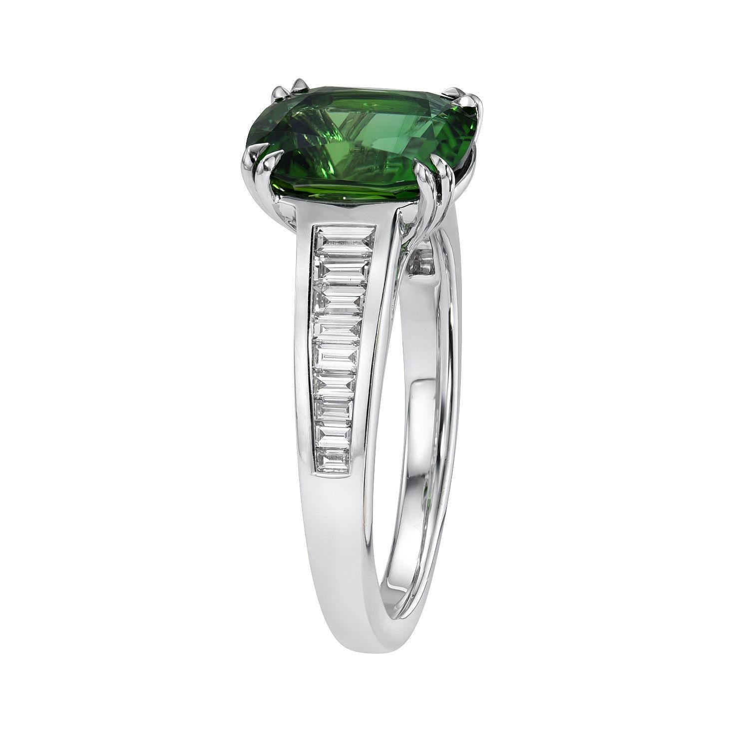 Exquisite and exclusive 2.75 carat Chrome Green Tourmaline cushion, 18K white gold ring, decorated with a total of 0.46 carat collection baguette diamonds.
Ring size 6.5. Resizing is complementary upon request.
Returns are accepted and paid by us