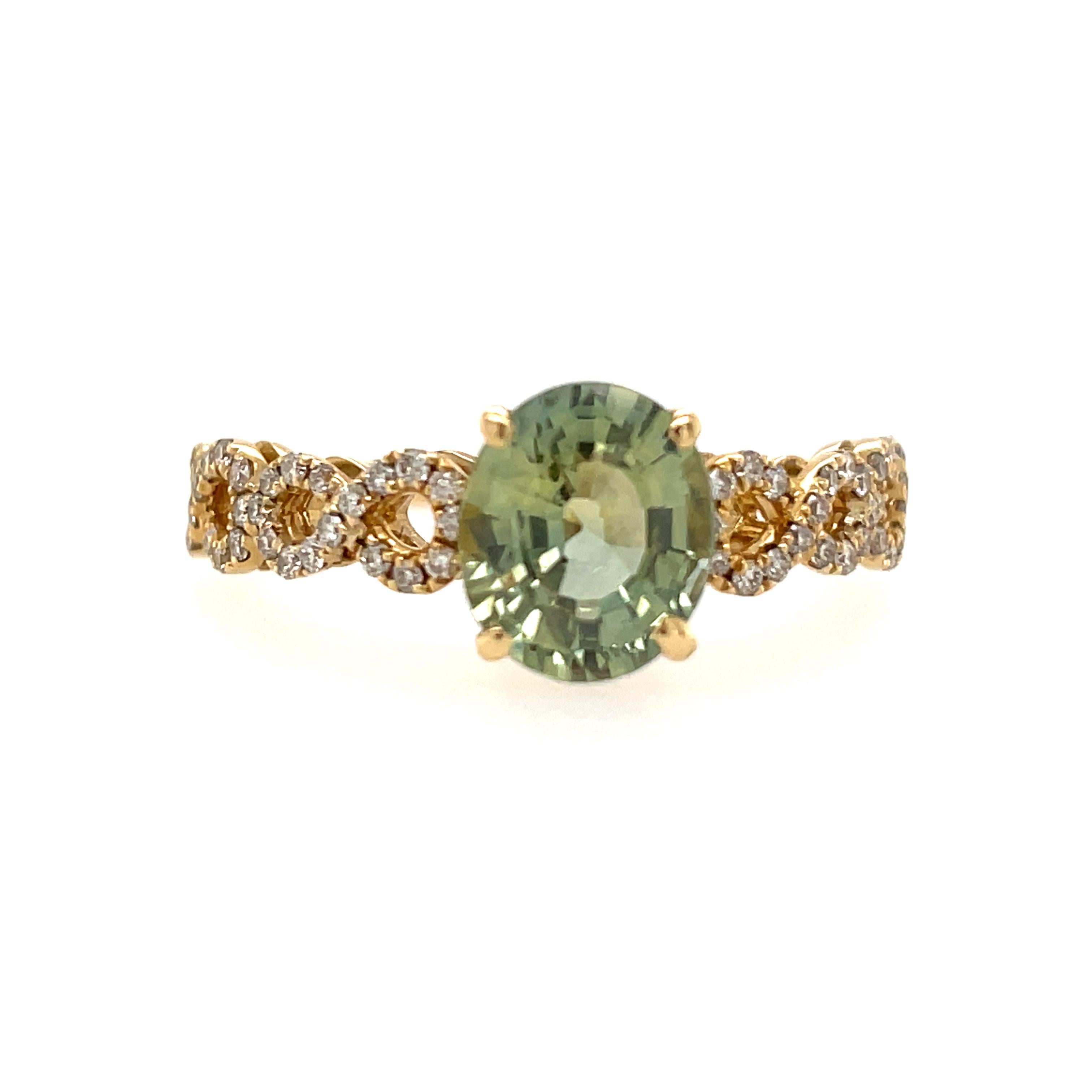 Featuring a rare chrysoberyl gemstone, this ring will become your favorite everyday ring. 

The 1.02ct vivid green Chrysoberyl is a classic oval shape, accented with high sparkle 0.25ct diamonds.  The gems are set in solid 14k yellow gold, which