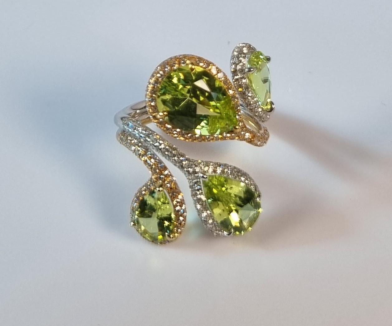 Green Chrysoberyl twisted  Ring with diamonds and bicolor gold
Total gems 5.60cts
Diamonds 307 E/F VVS total 1.68ct
Weight 6.92gr
Size 55 Europe 7,1/2 US
Irama Pradera is a dynamic and outgoing designer from Spain that searches always for the best