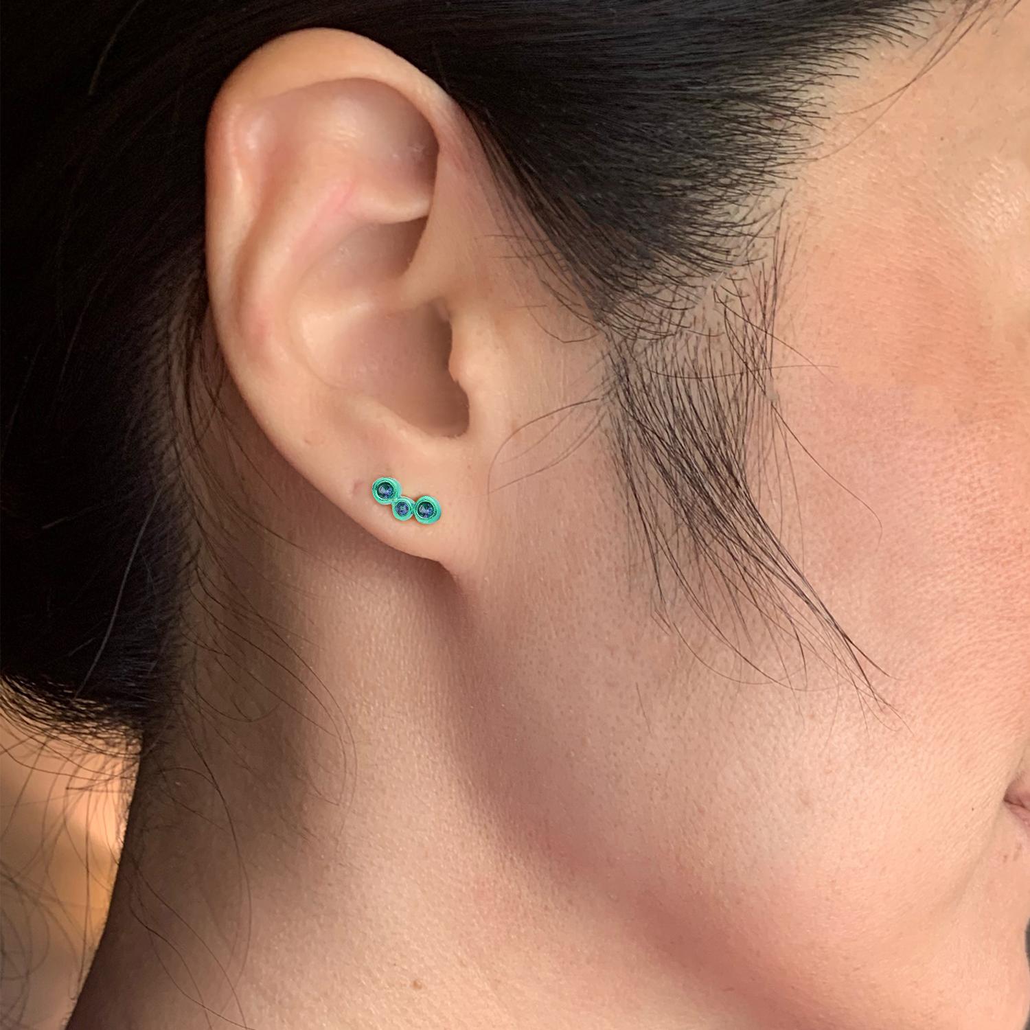 Hi June Parker's mini version of her climber earrings, adding a pop of
electric emerald Green to your ears with this 3-stone SINGLE stud.

Inspired by seeing the cross-section view of life, as if slicing a tree to see its underlying structure and